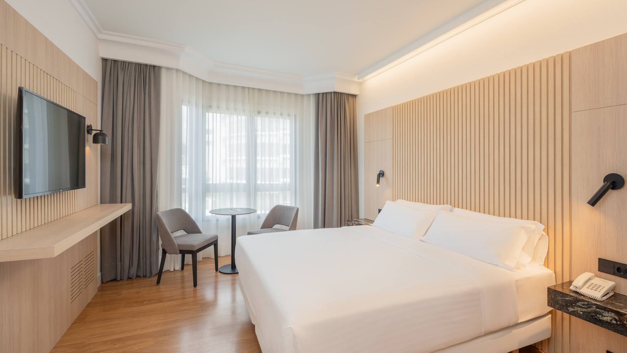 a room with a bed and a desk