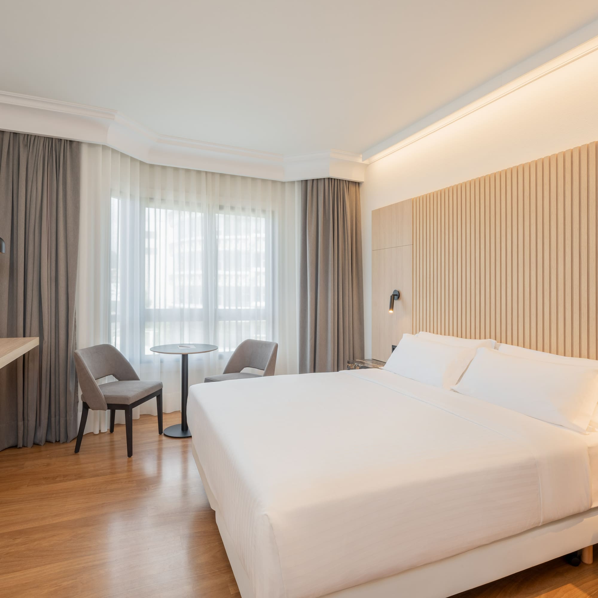 a room with a bed and a desk