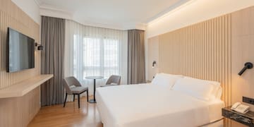 a room with a bed and a desk