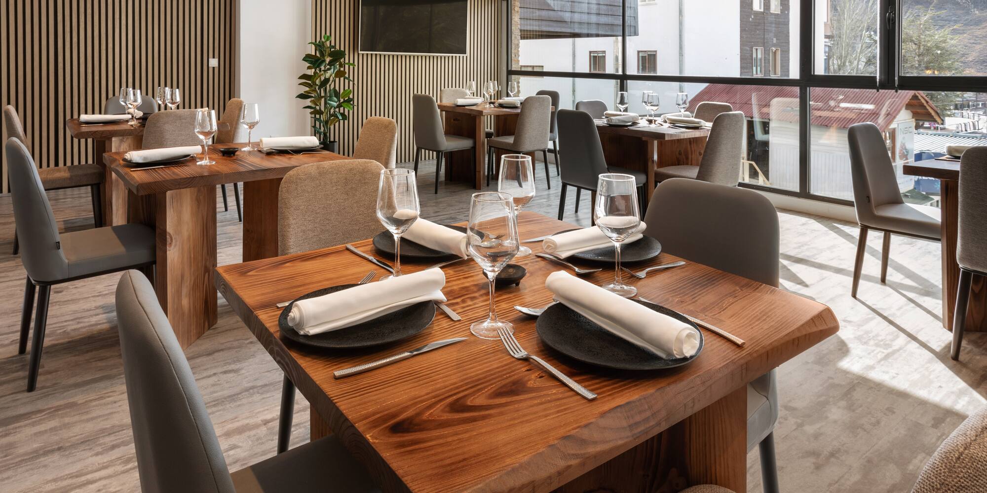 a restaurant with tables and chairs