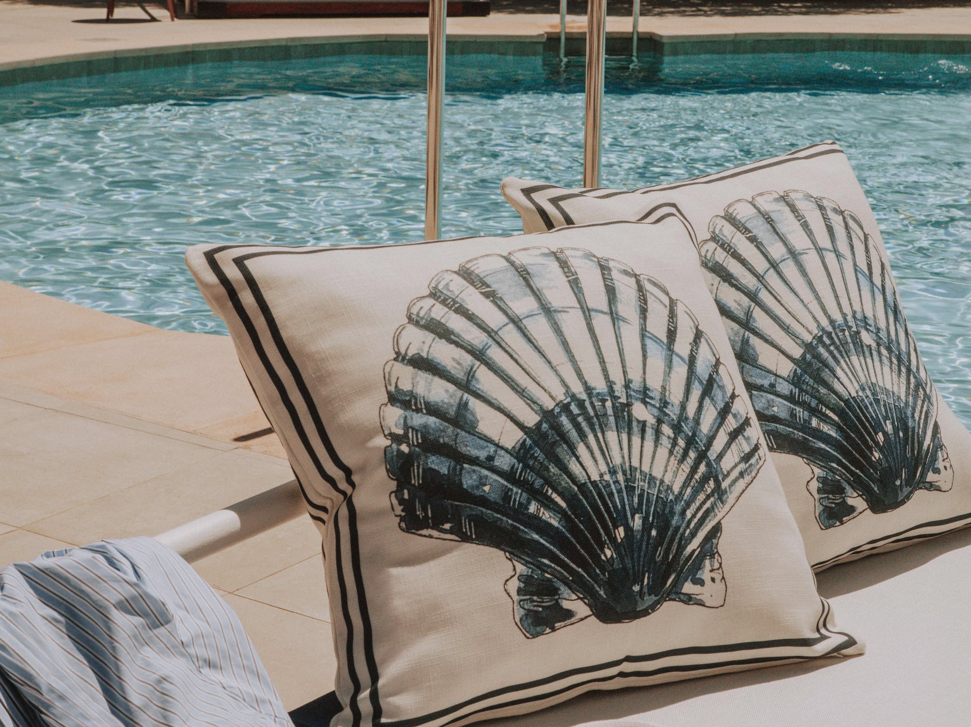 a pool with a hat and pillows