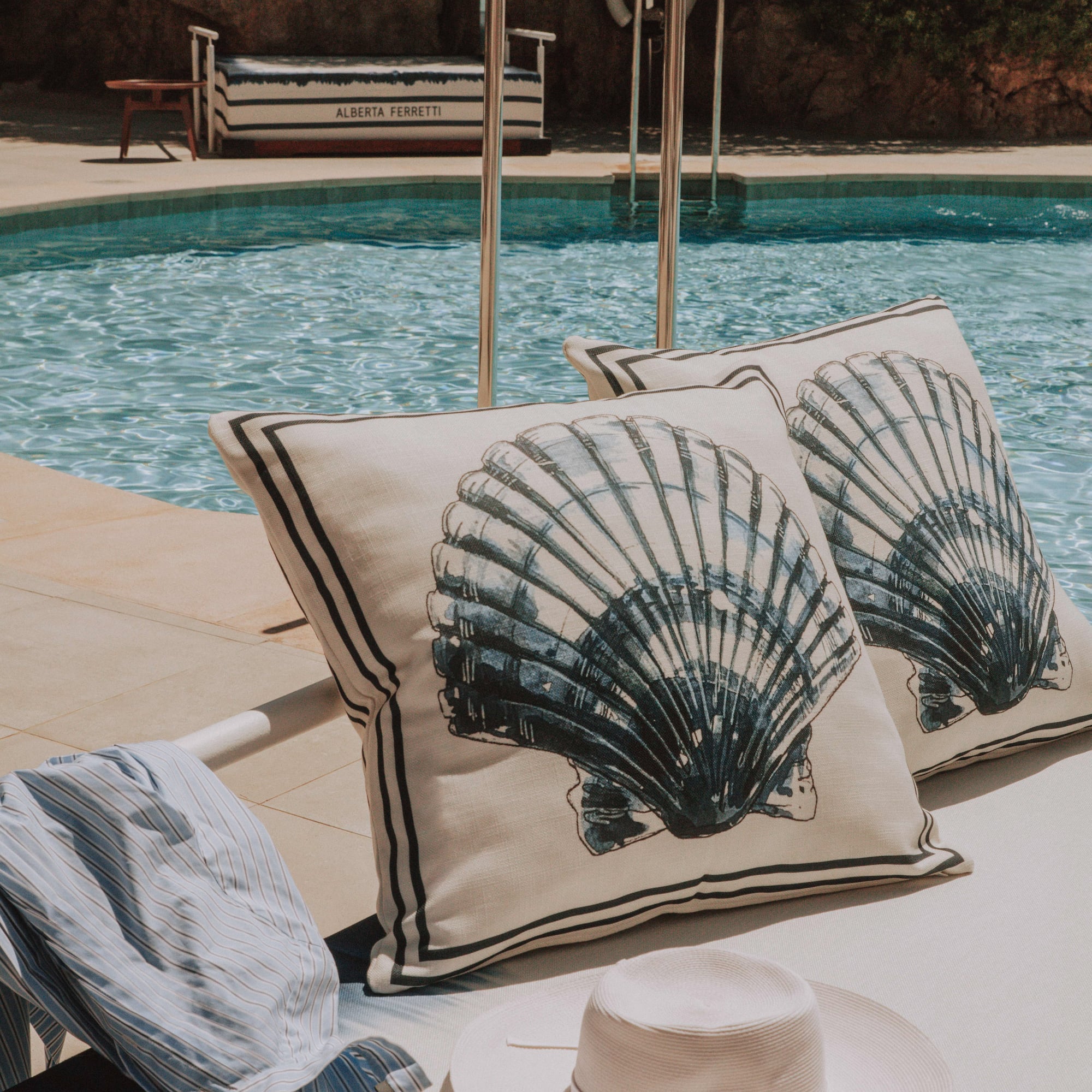 a pool with a hat and pillows