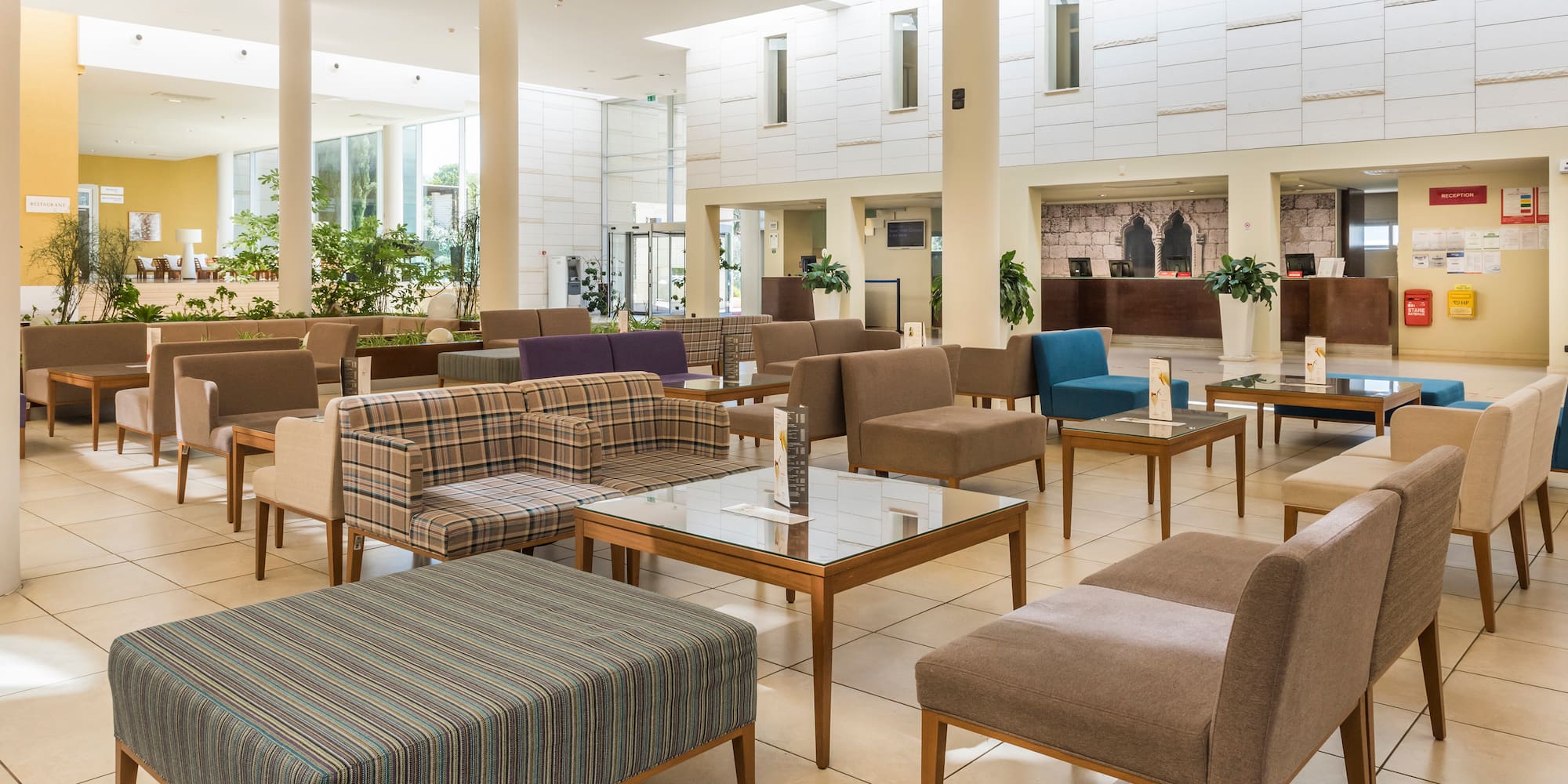 a room with couches and tables