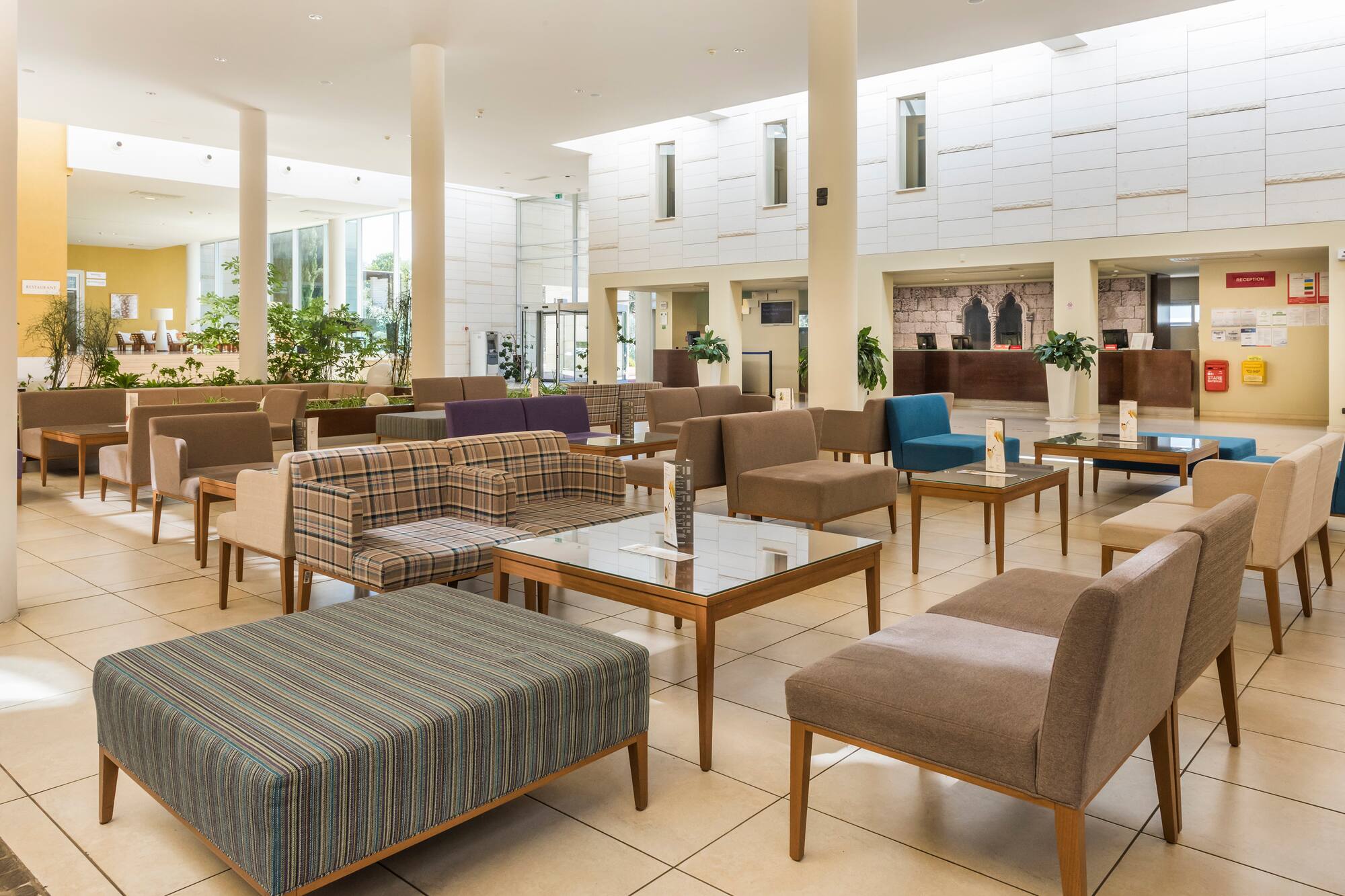 a room with couches and tables