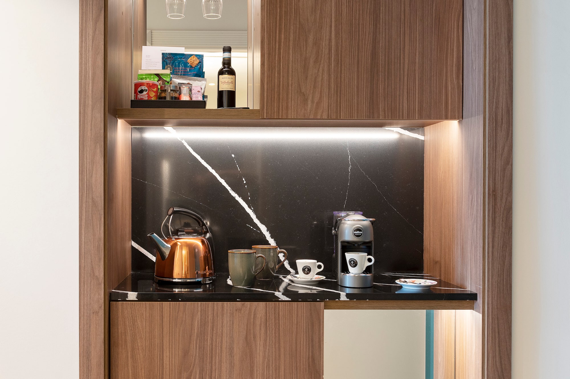 a kitchen with a counter top and a shelf