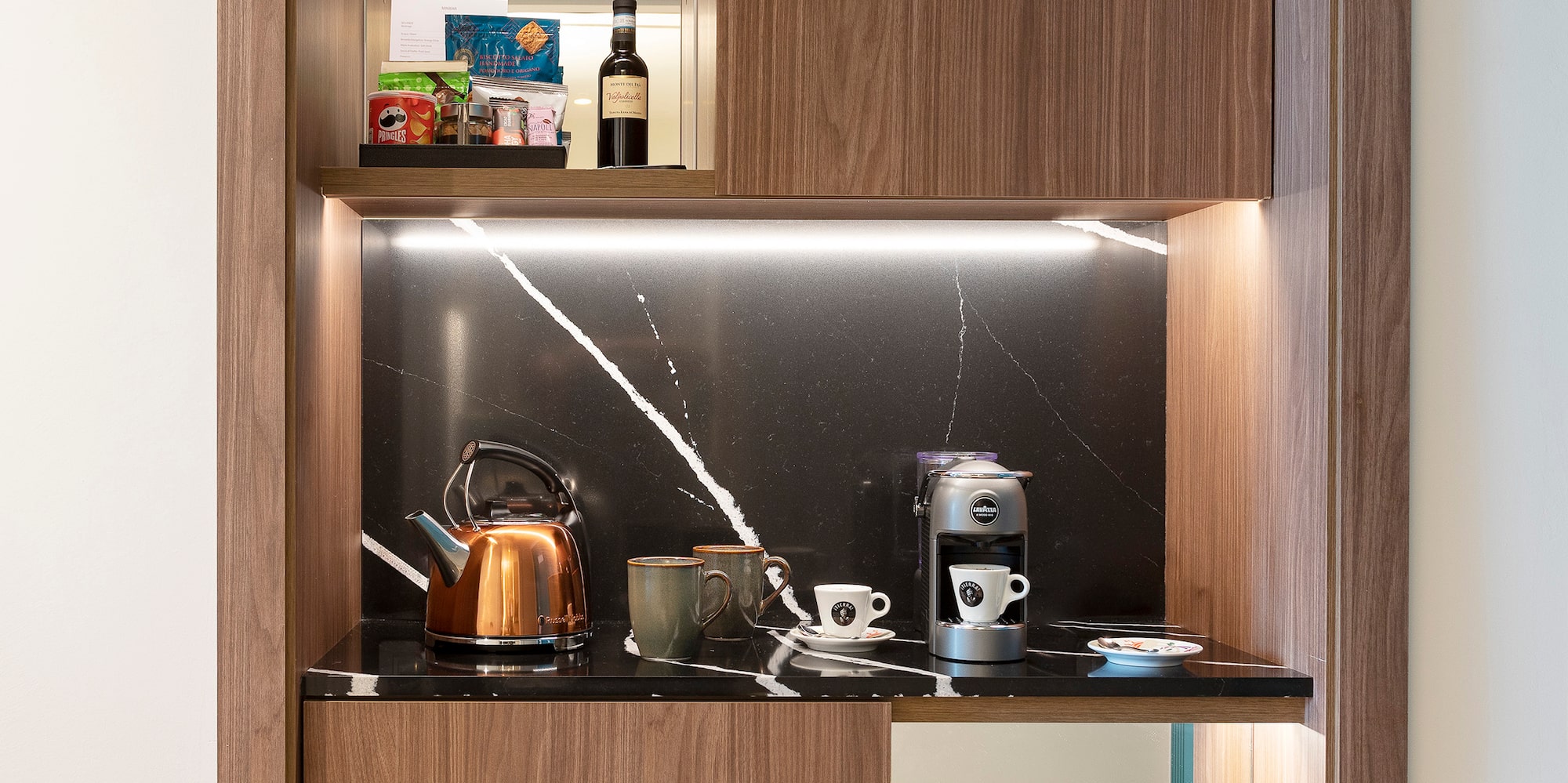 a kitchen with a counter top and a shelf