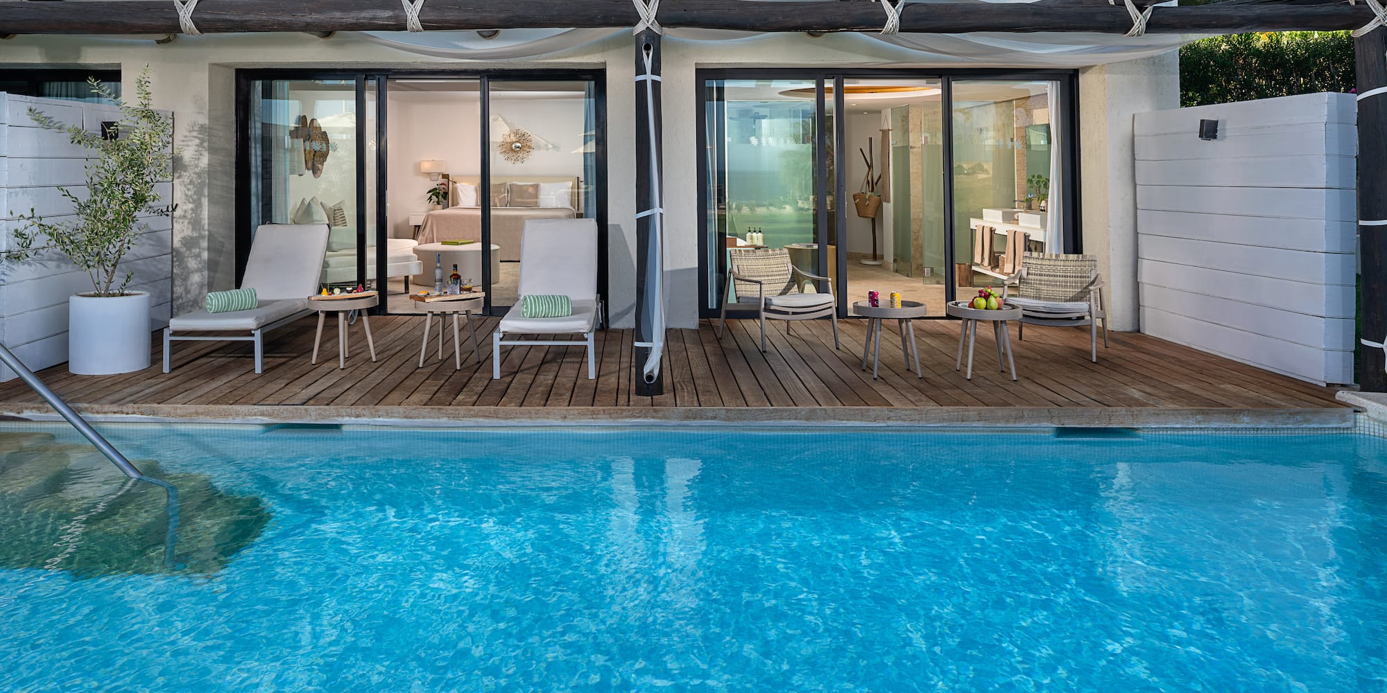 a pool with chairs and chairs on deck