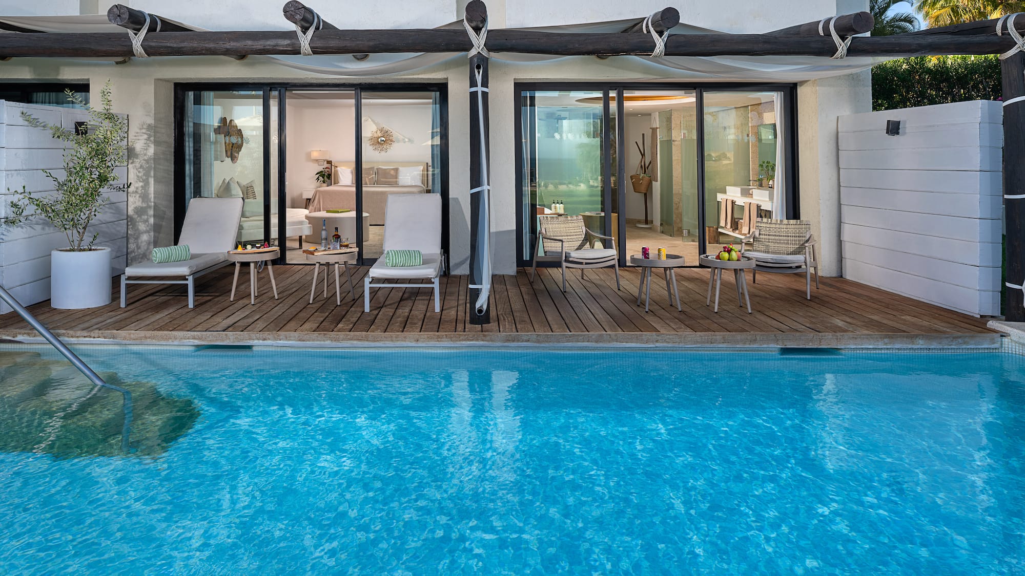 a pool with chairs and chairs on deck