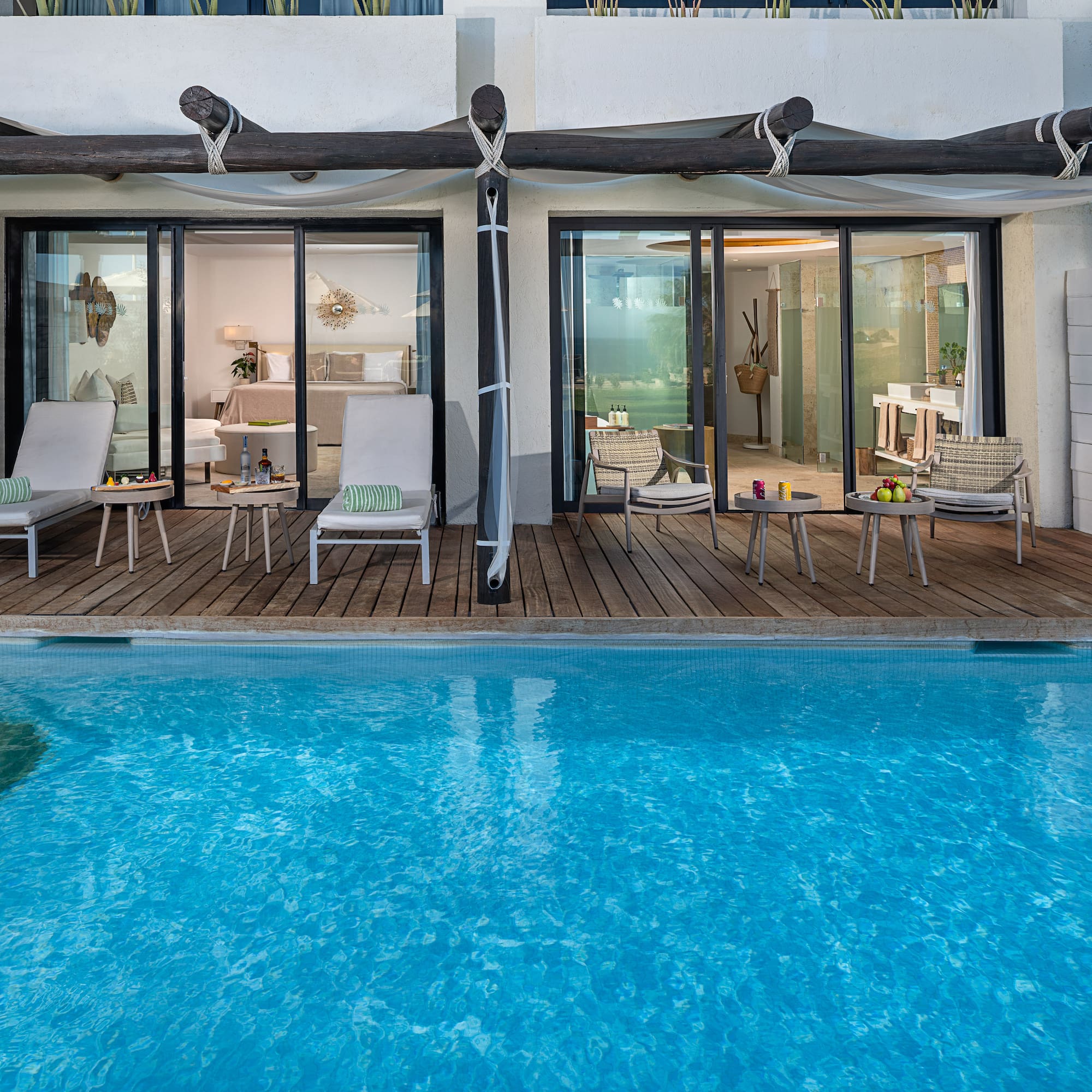 a pool with chairs and chairs on deck