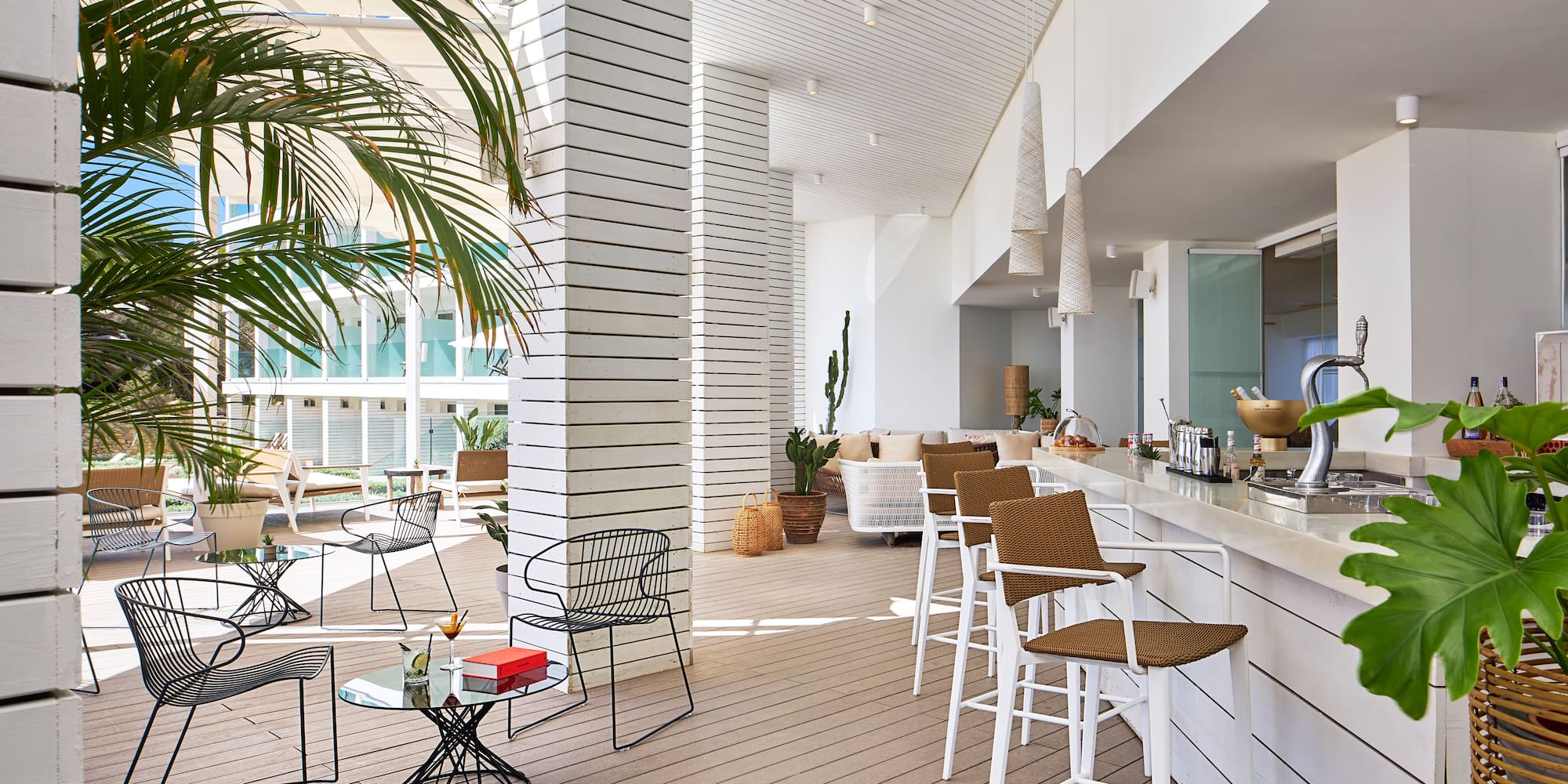 a white room with chairs and tables