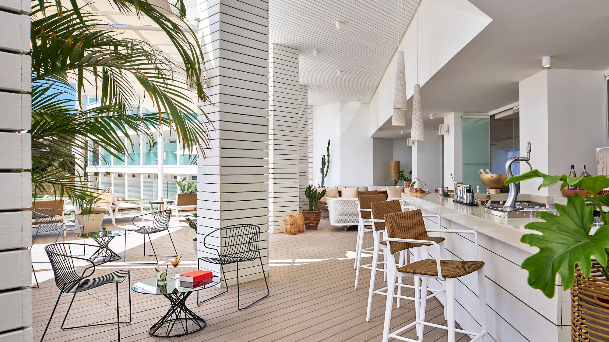 a white room with chairs and tables