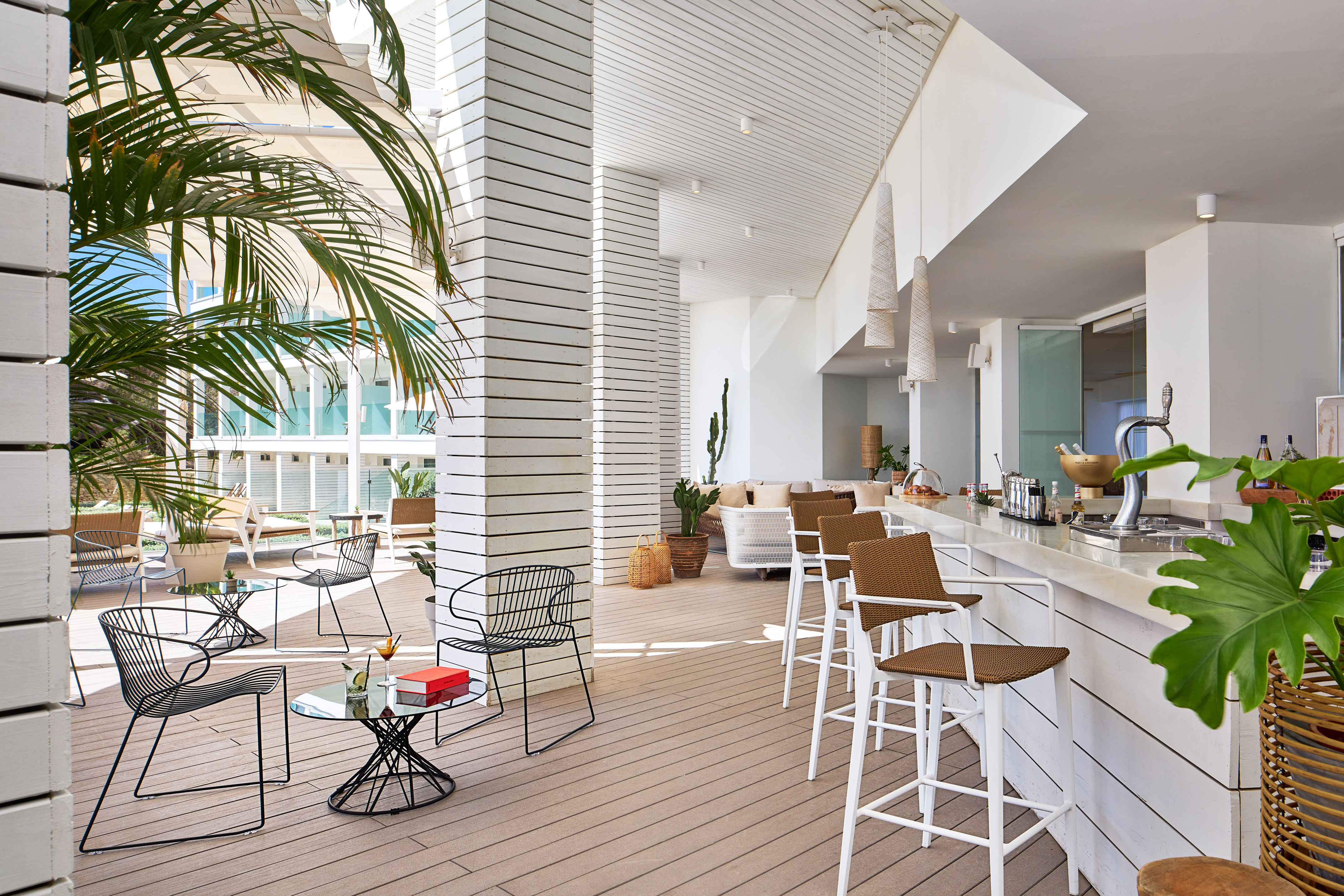 a white room with chairs and tables