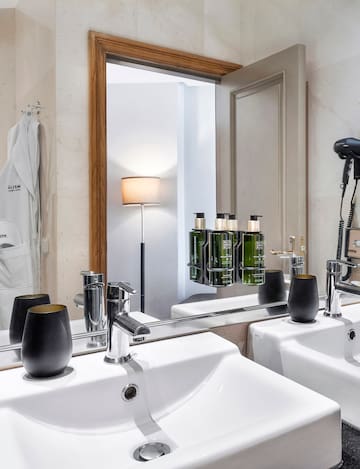 a bathroom with a mirror and sink