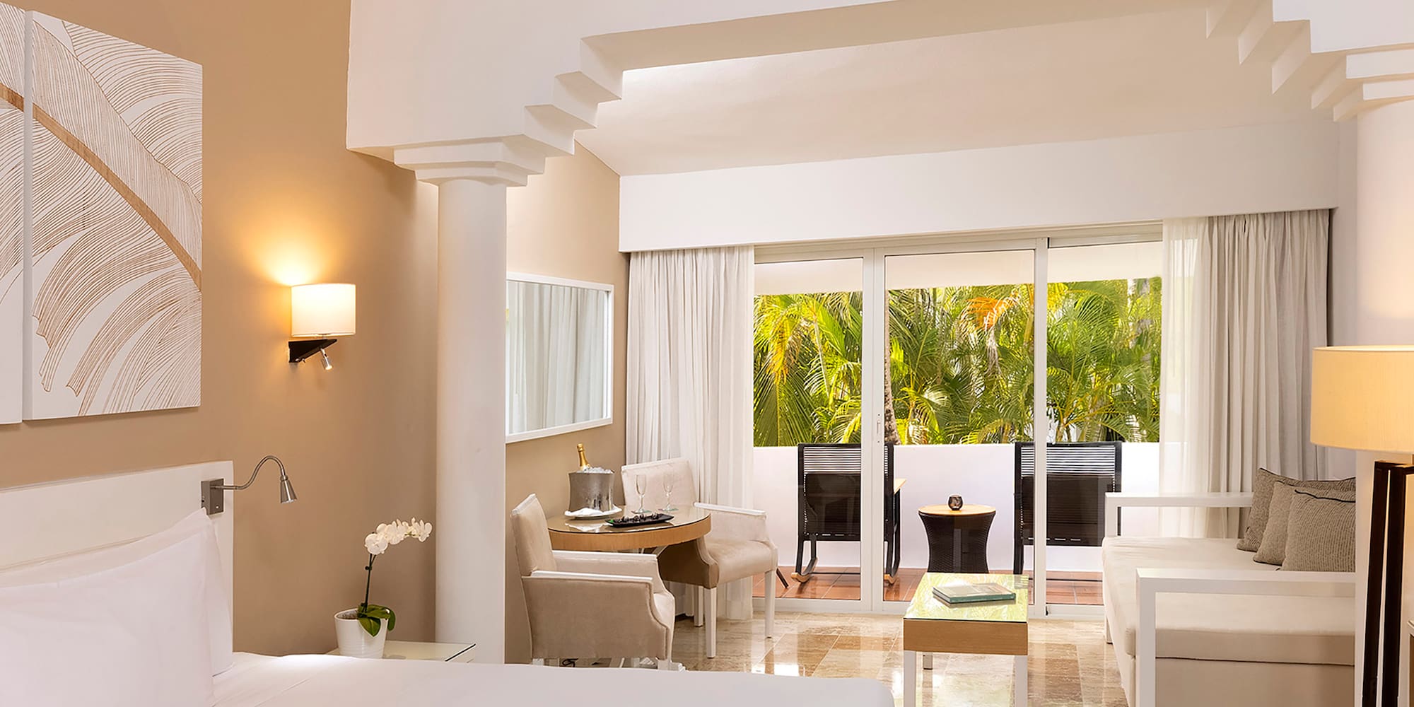 a room with a bed and a ceiling fan