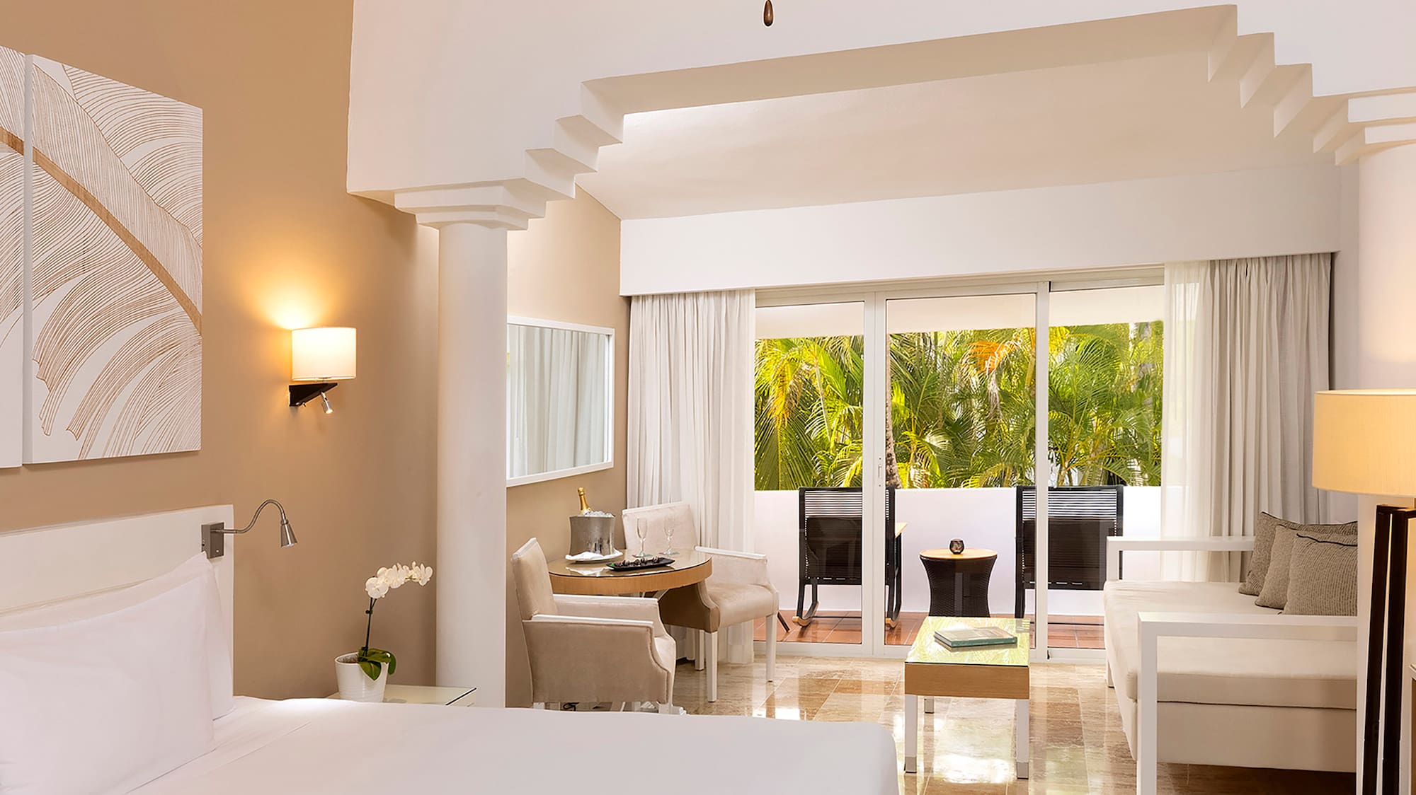 a room with a bed and a ceiling fan