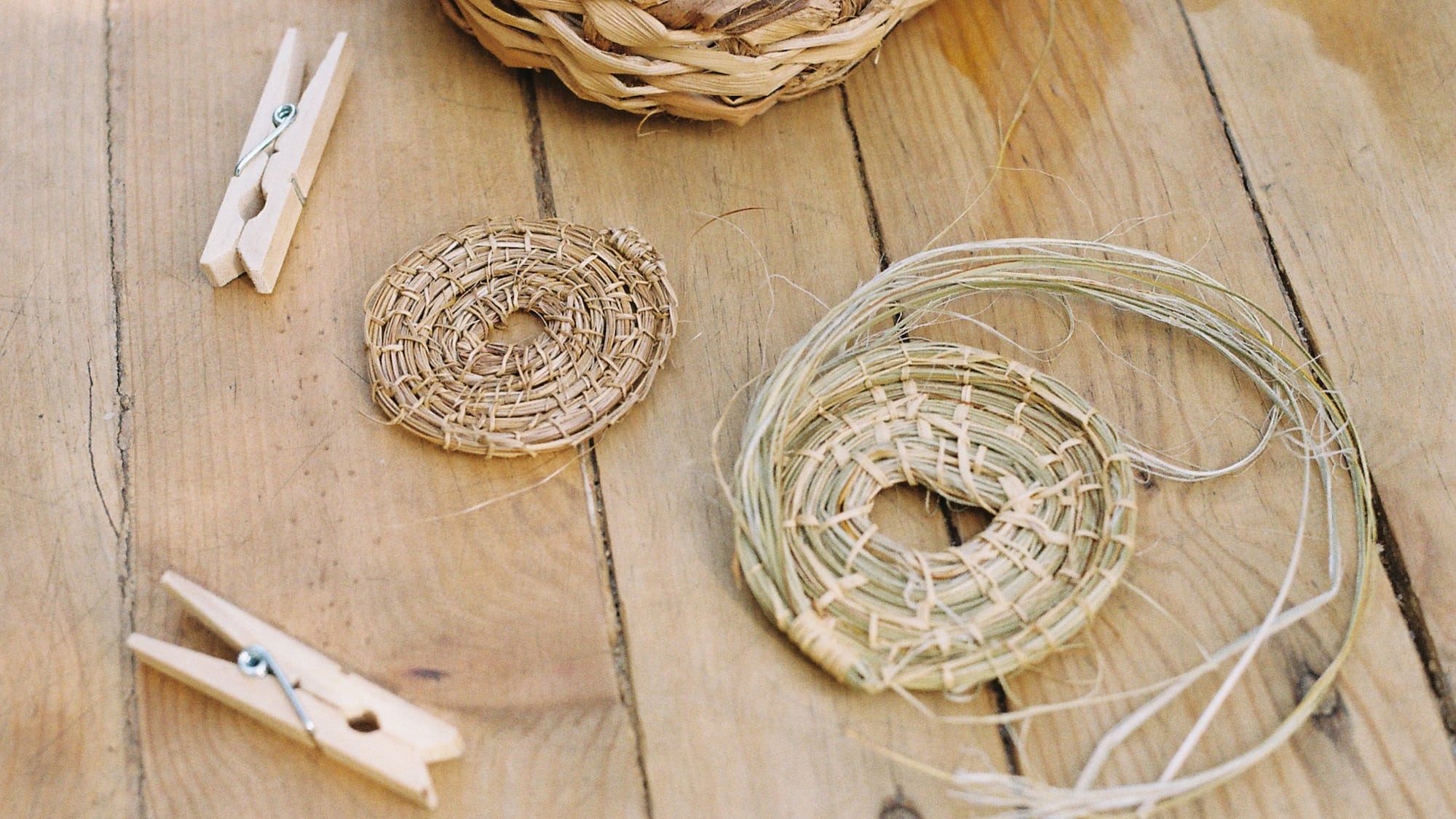 a basket and clothespins on a table