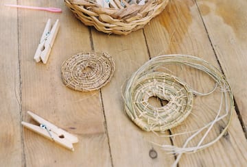 a basket and clothespins on a table