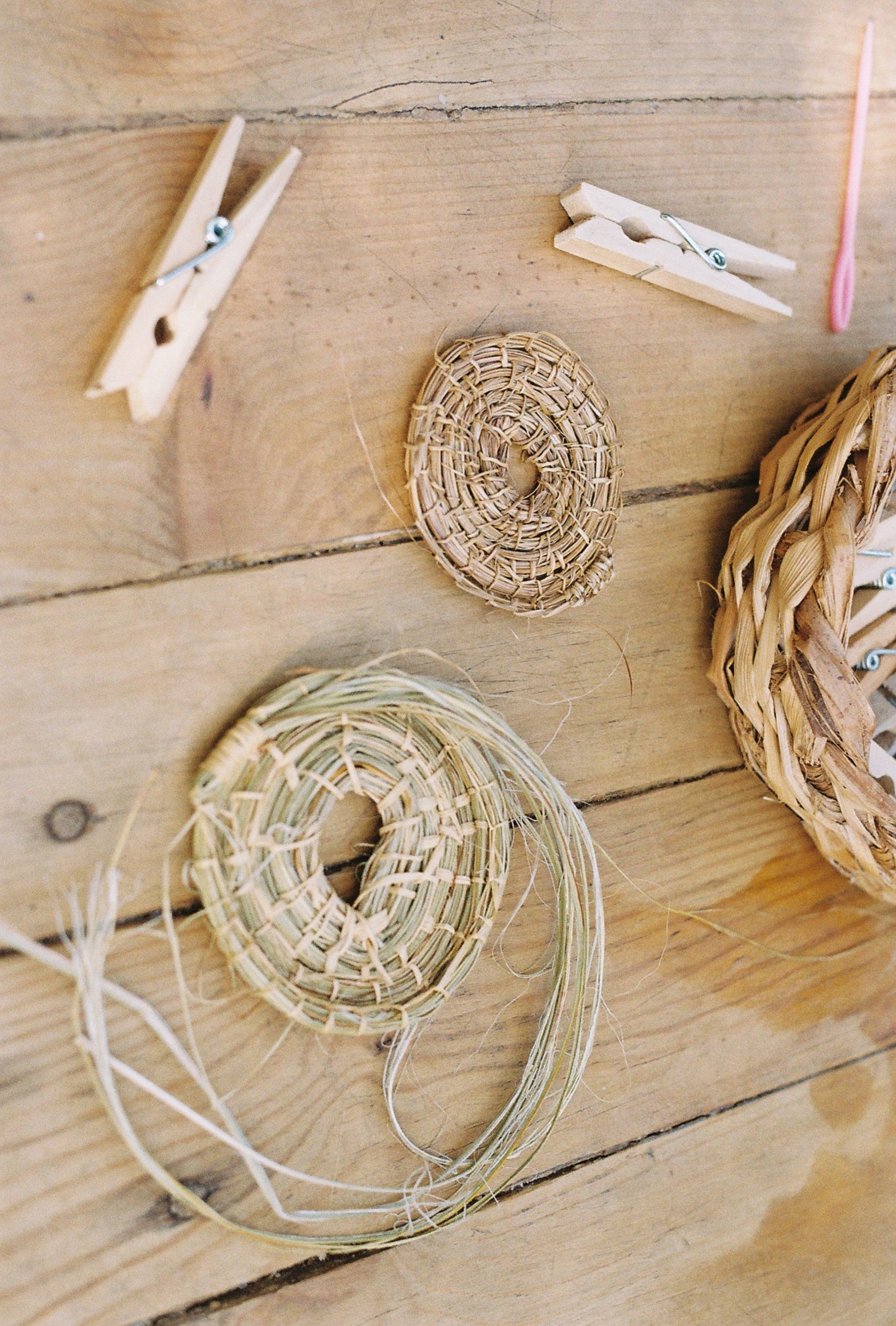 a basket and clothespins on a table