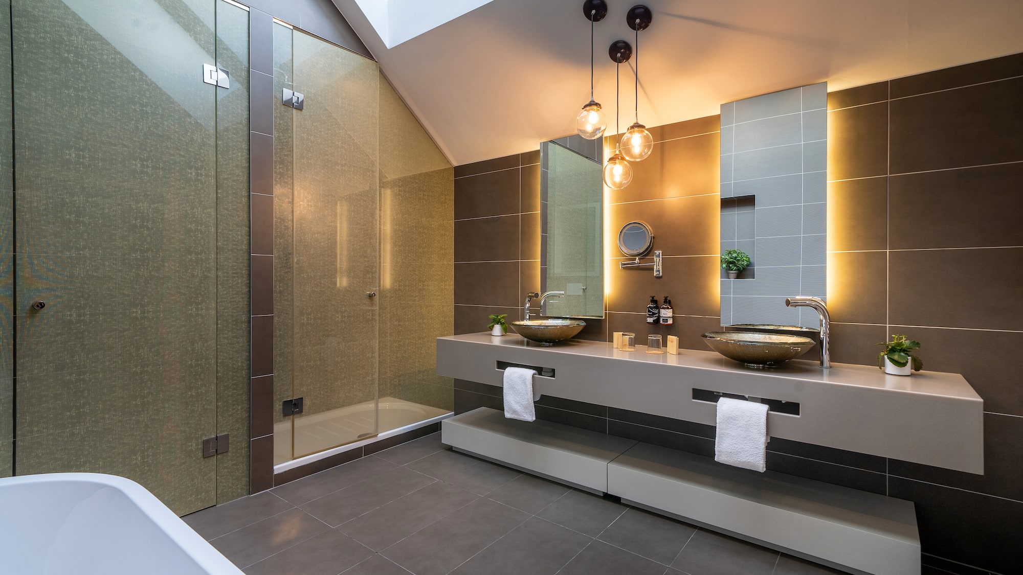 a bathroom with a shower and two sinks