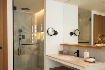 a bathroom with a shower and sink