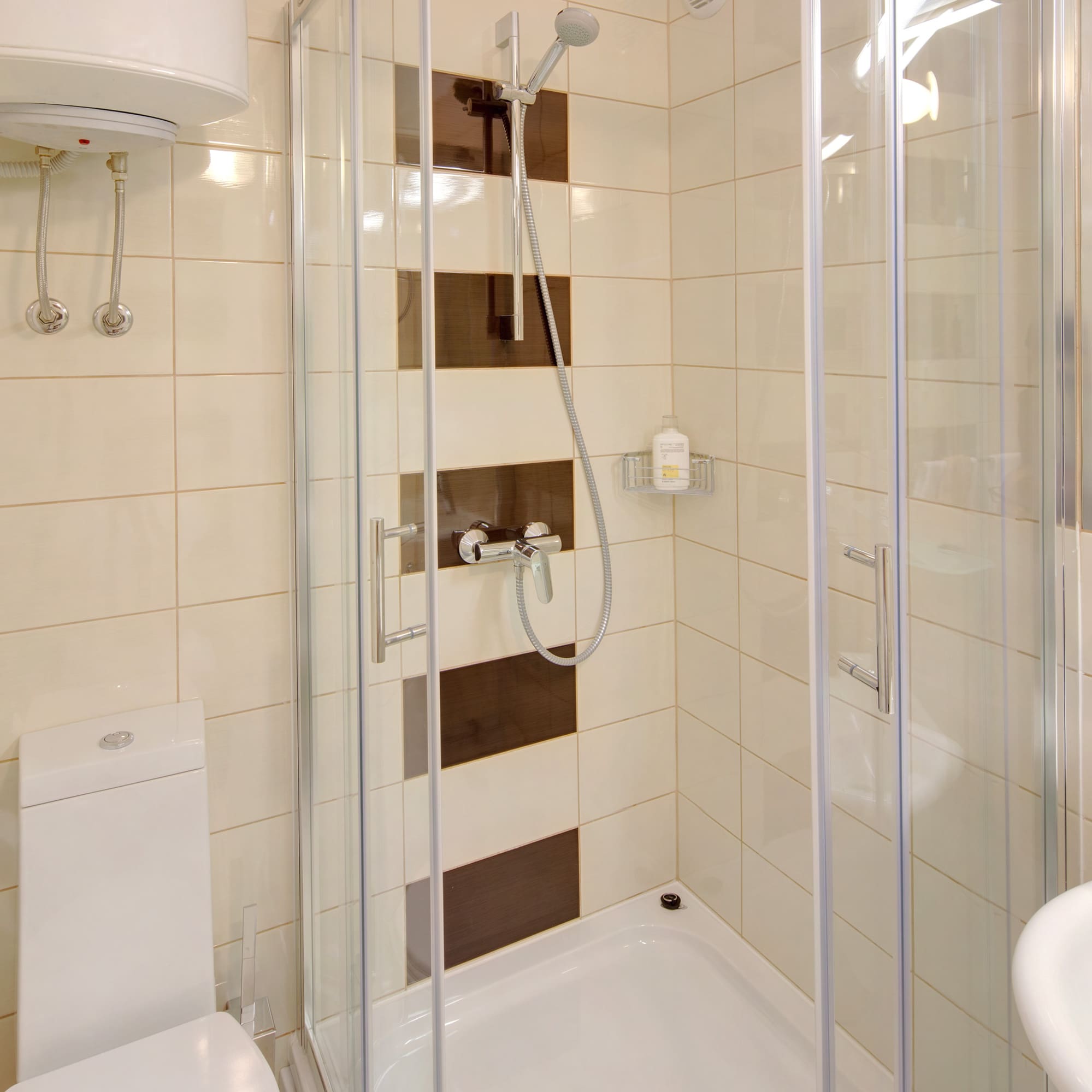 a bathroom with a shower and toilet