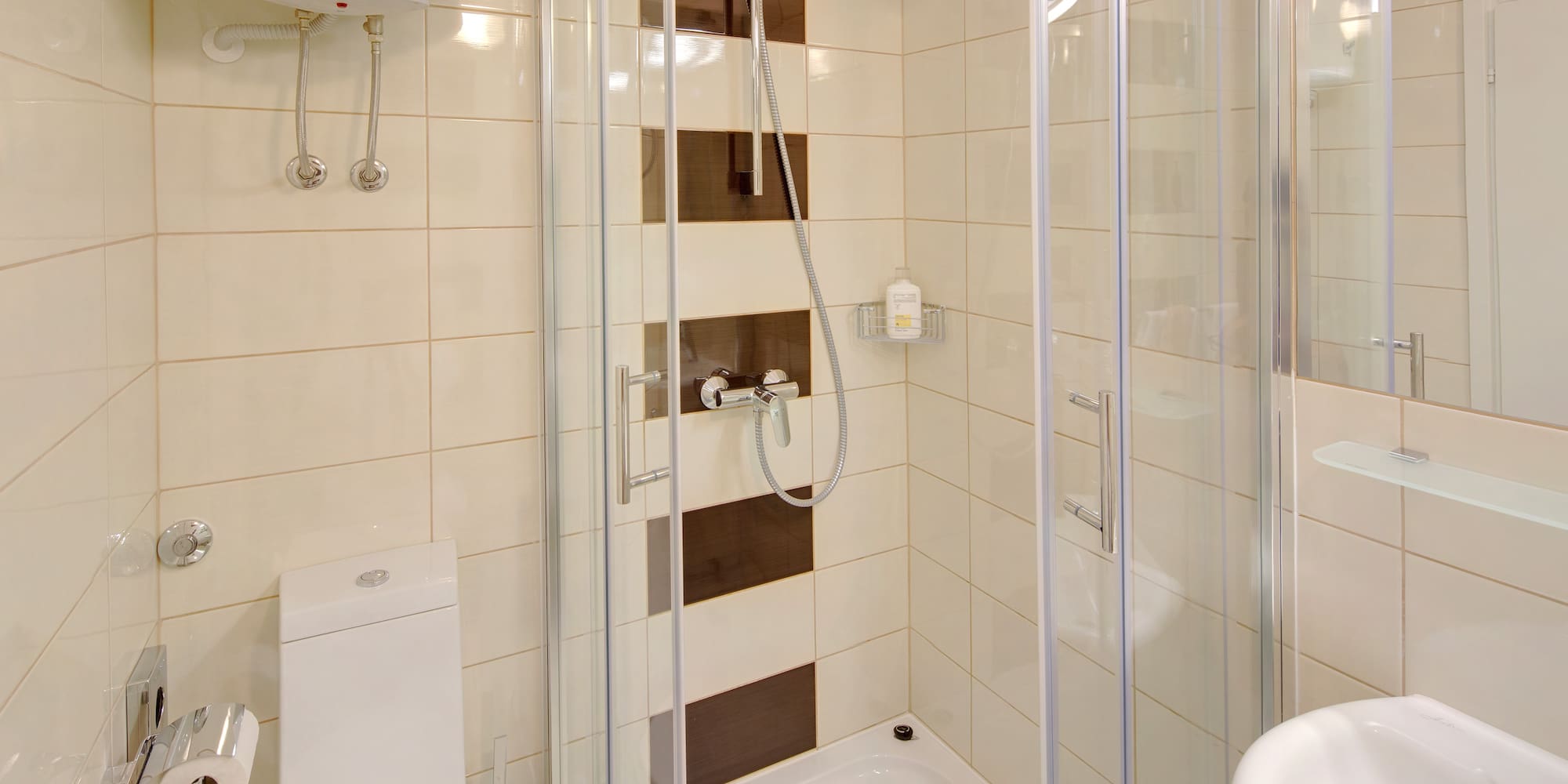 a bathroom with a shower and toilet