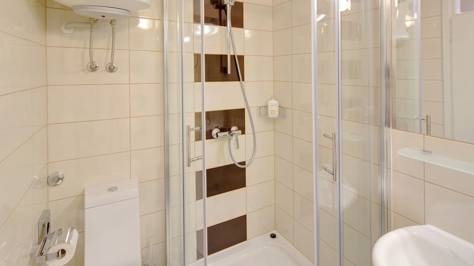 a bathroom with a shower and toilet