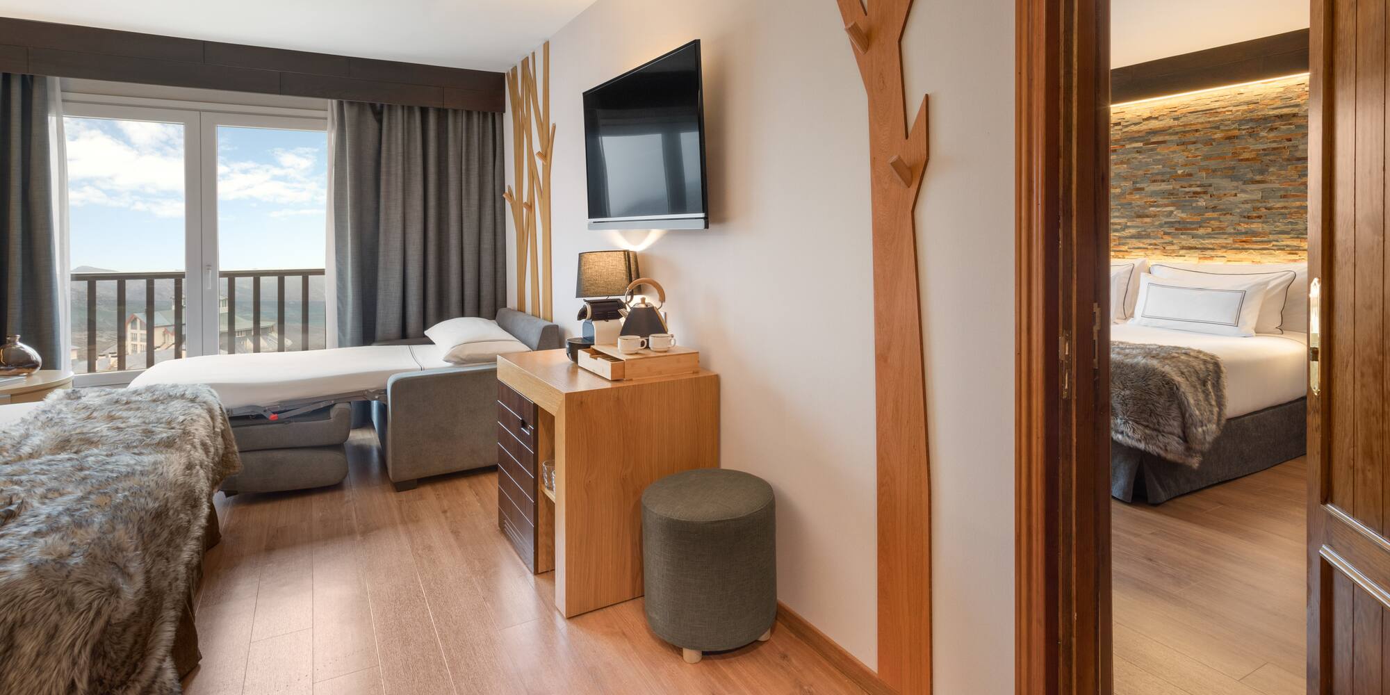 a room with a tv and a bed