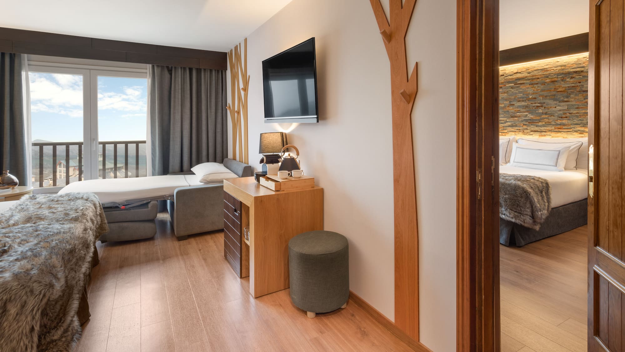 a room with a tv and a bed