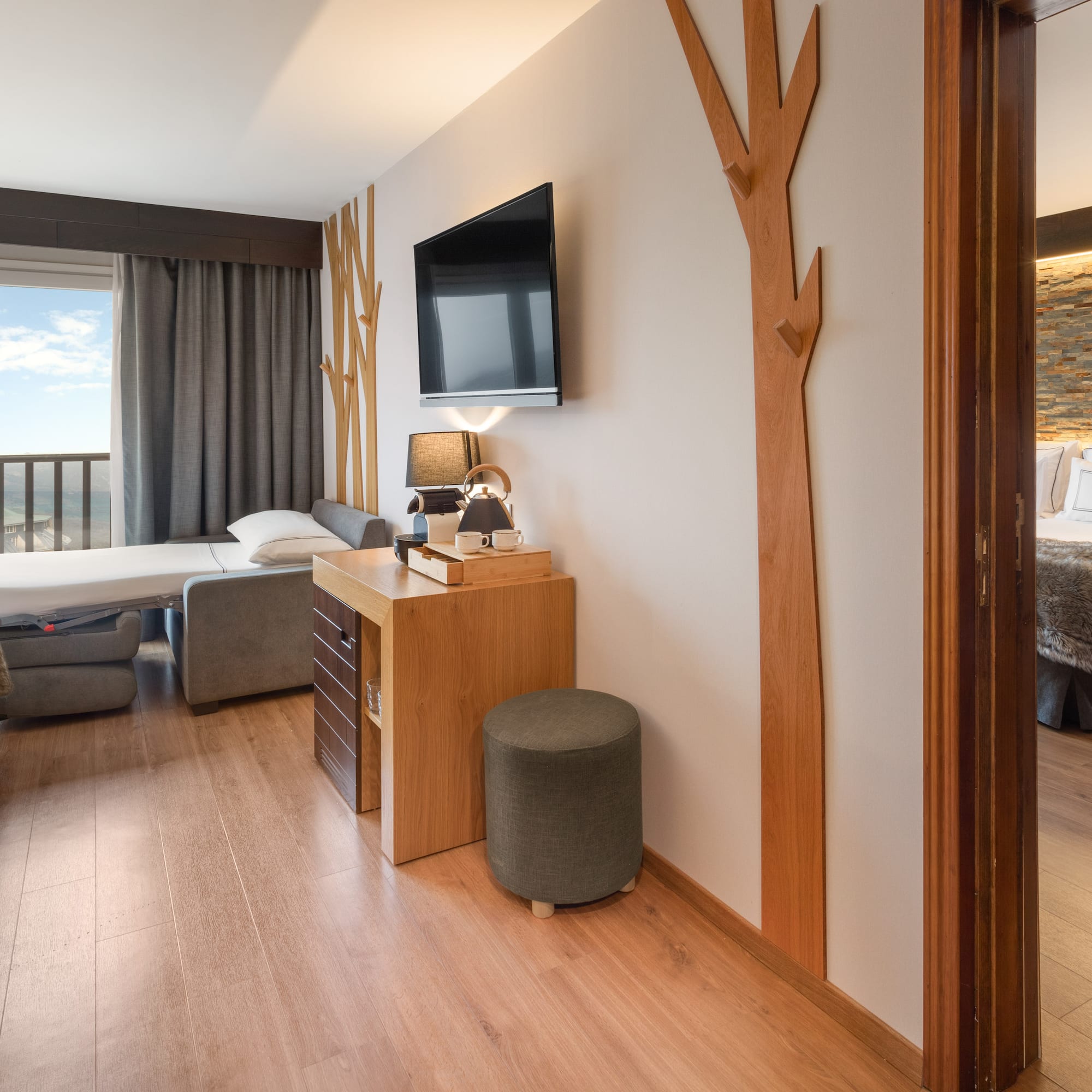 a room with a tv and a bed