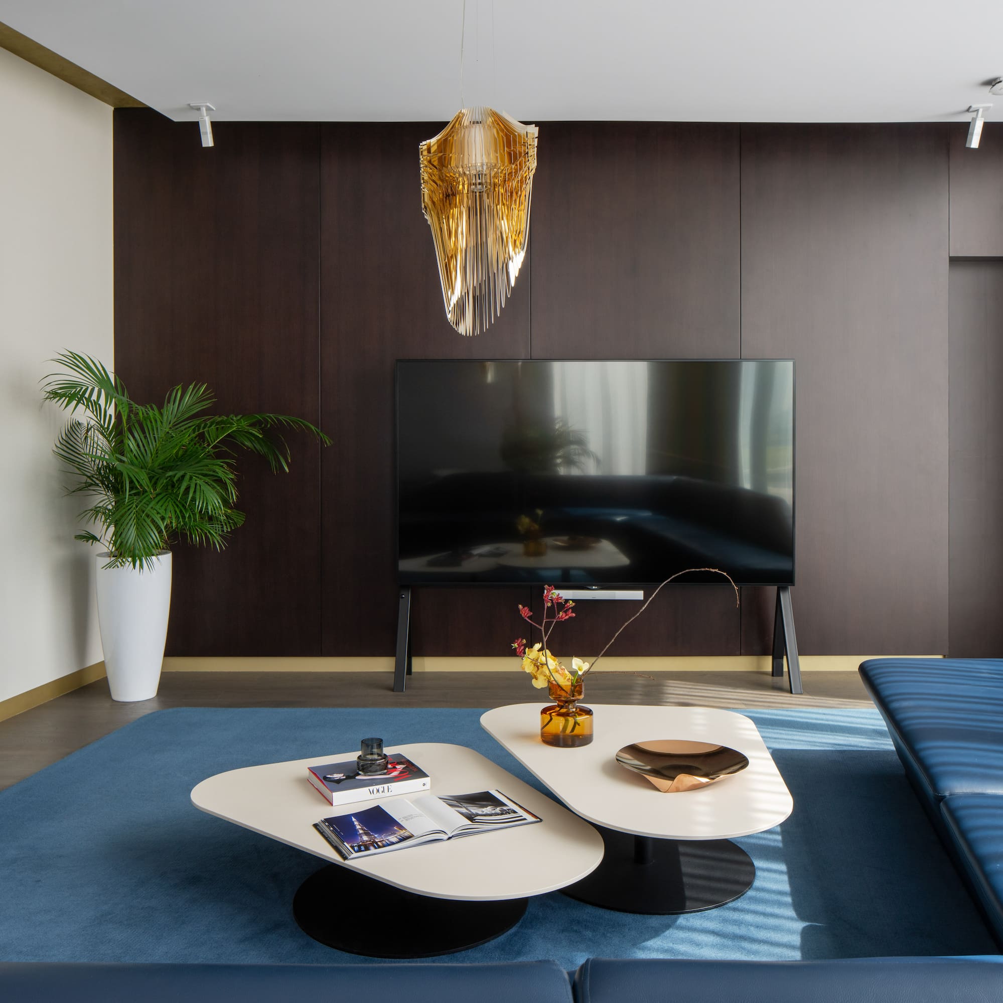 a living room with a television and a couch