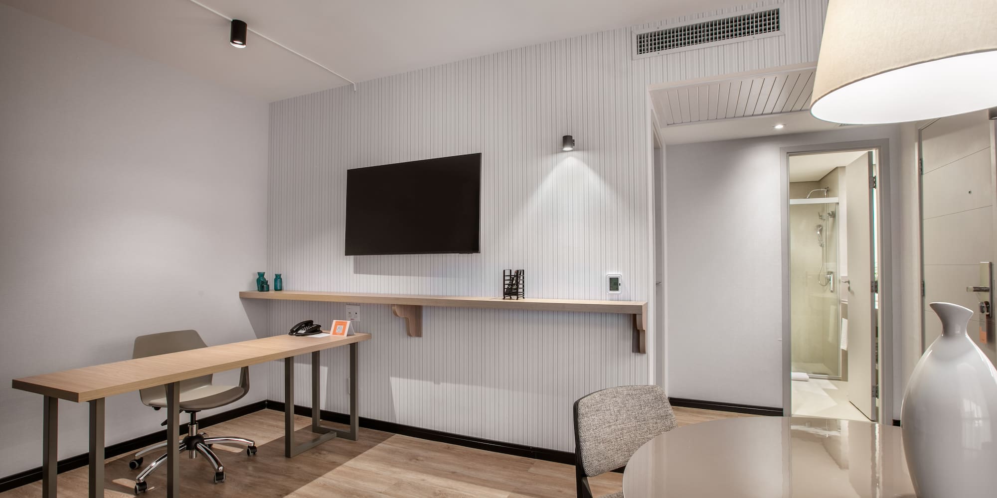 a room with a table and chairs