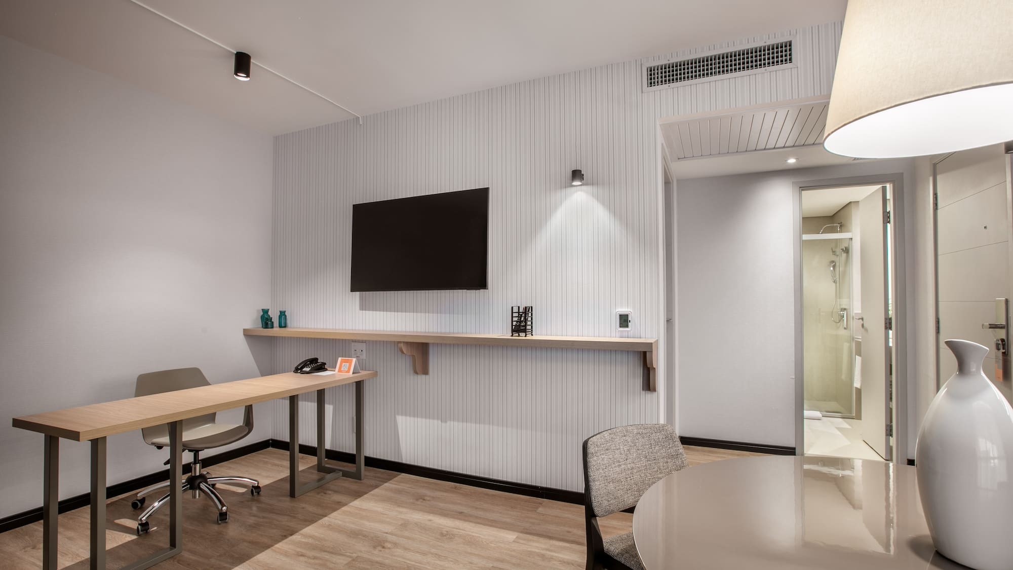 a room with a table and chairs