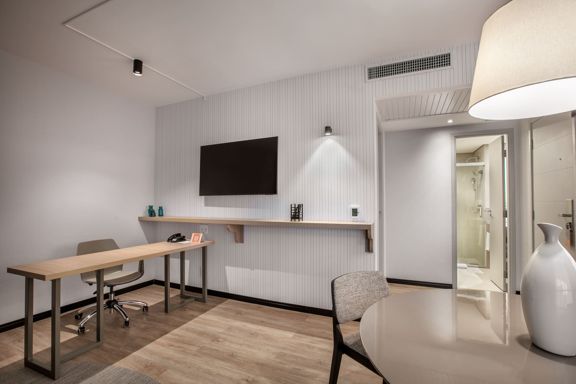 a room with a table and chairs