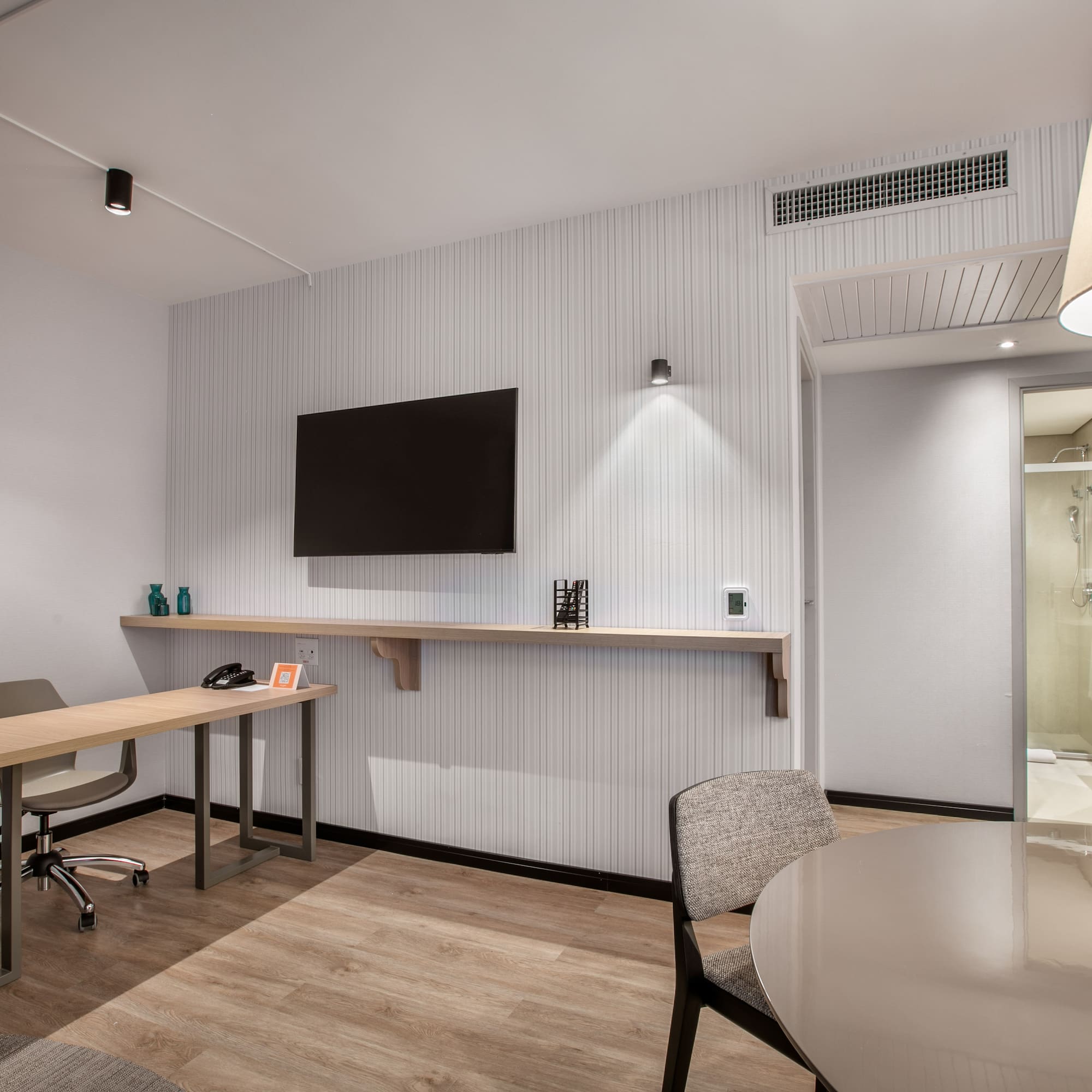 a room with a table and chairs