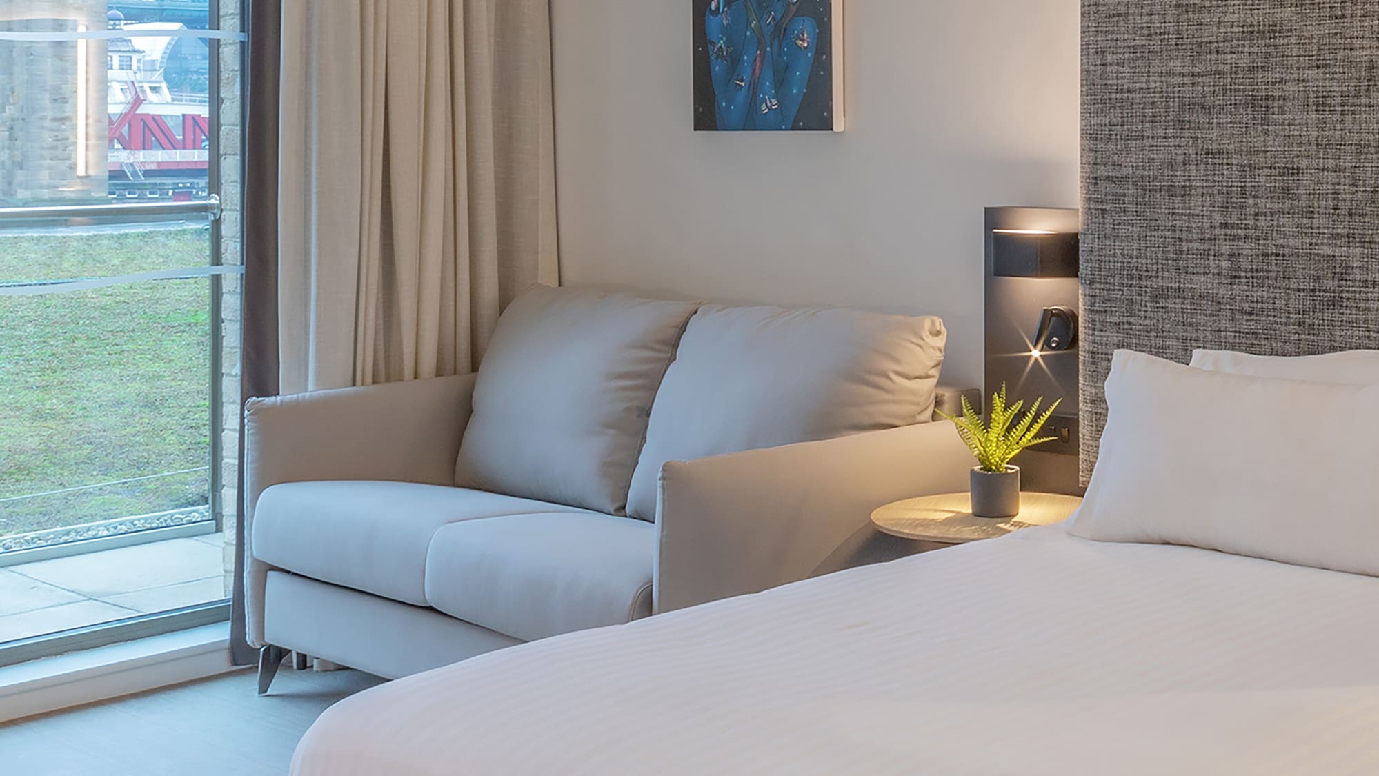 a bed and couch in a room