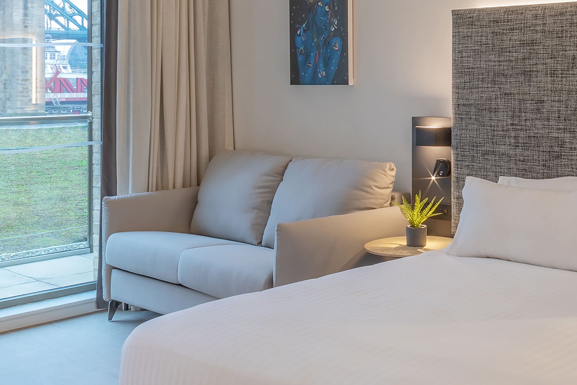 a bed and couch in a room