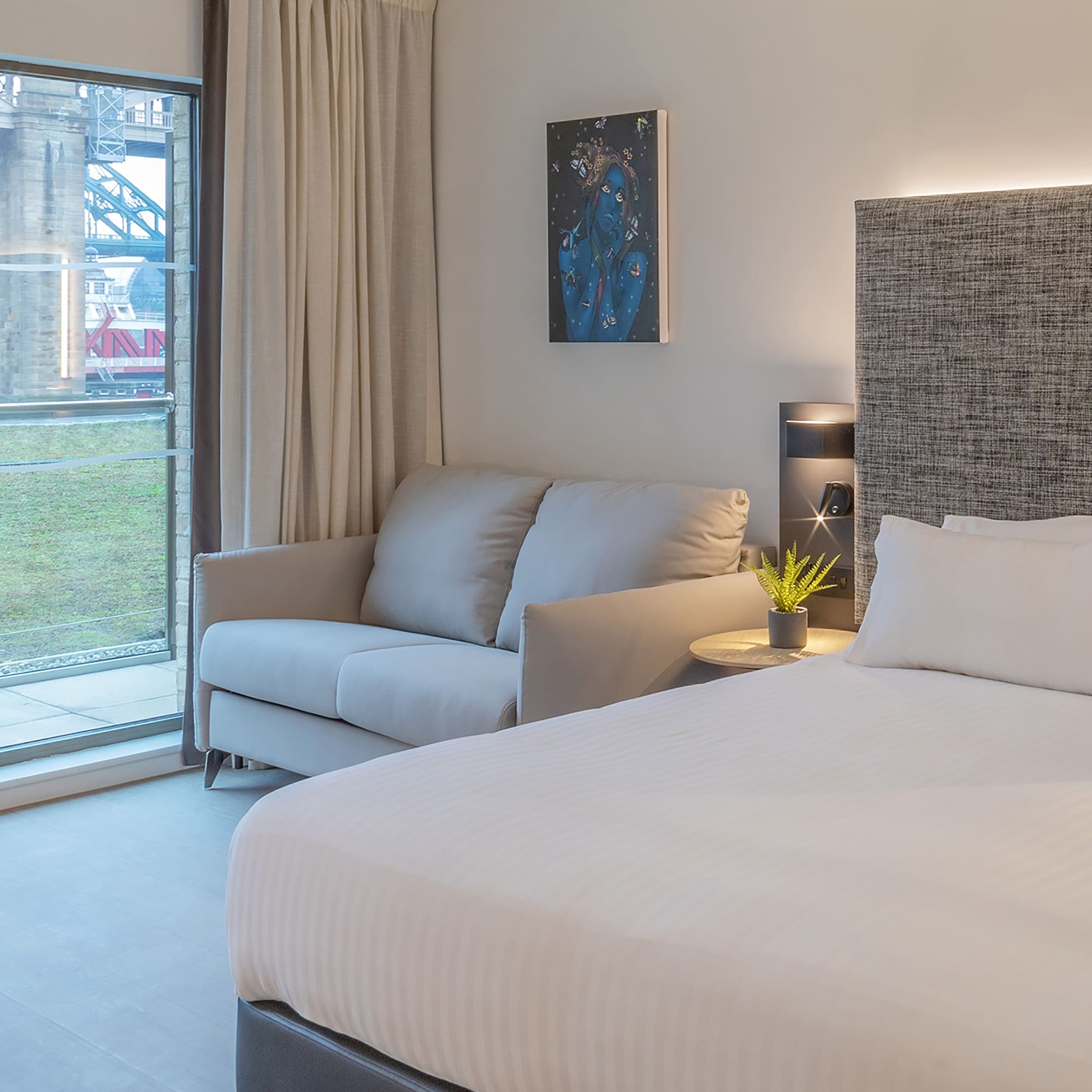 a bed and couch in a room