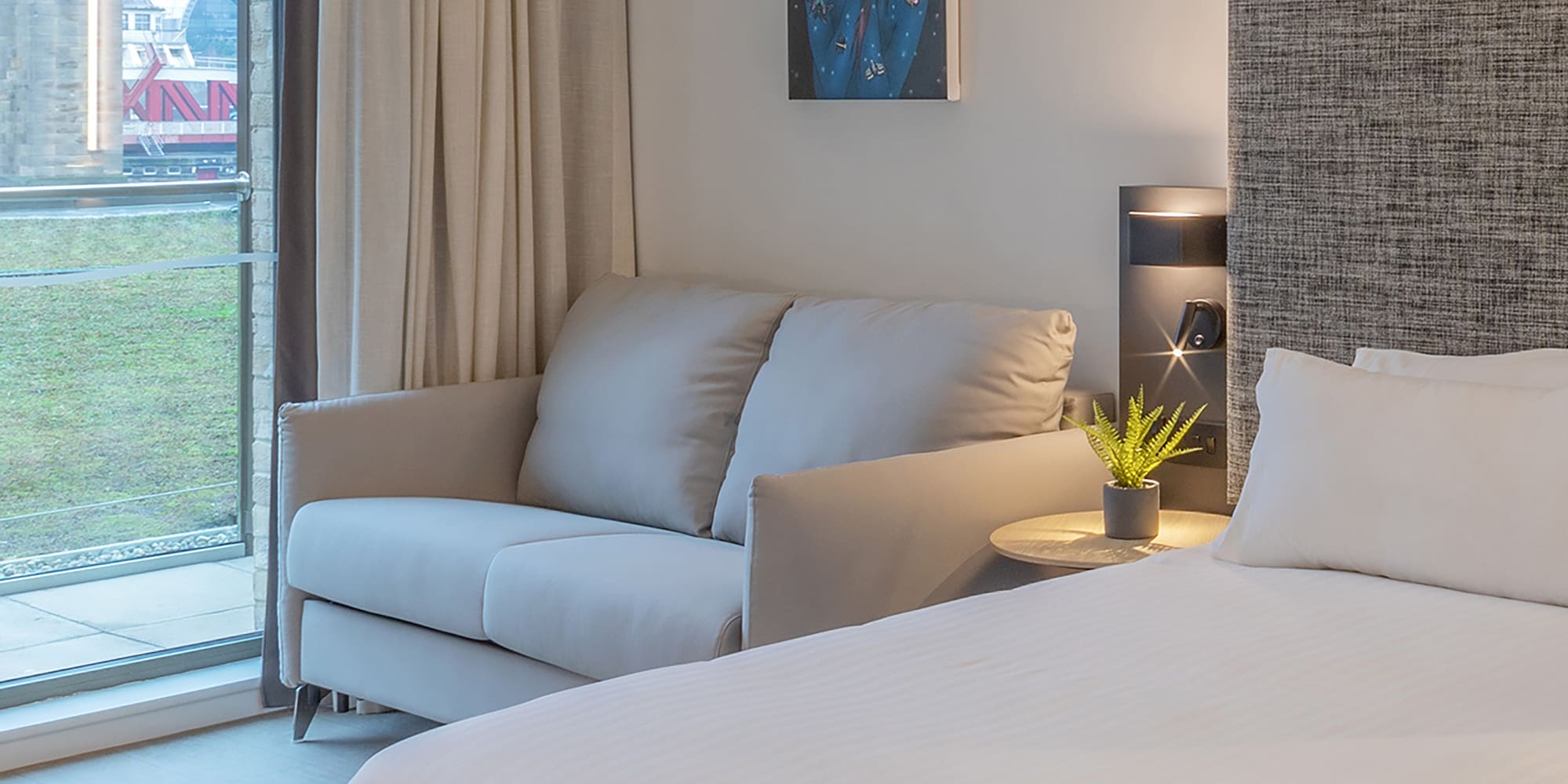 a bed and couch in a room