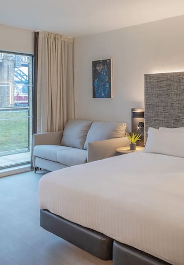 a bed and couch in a room