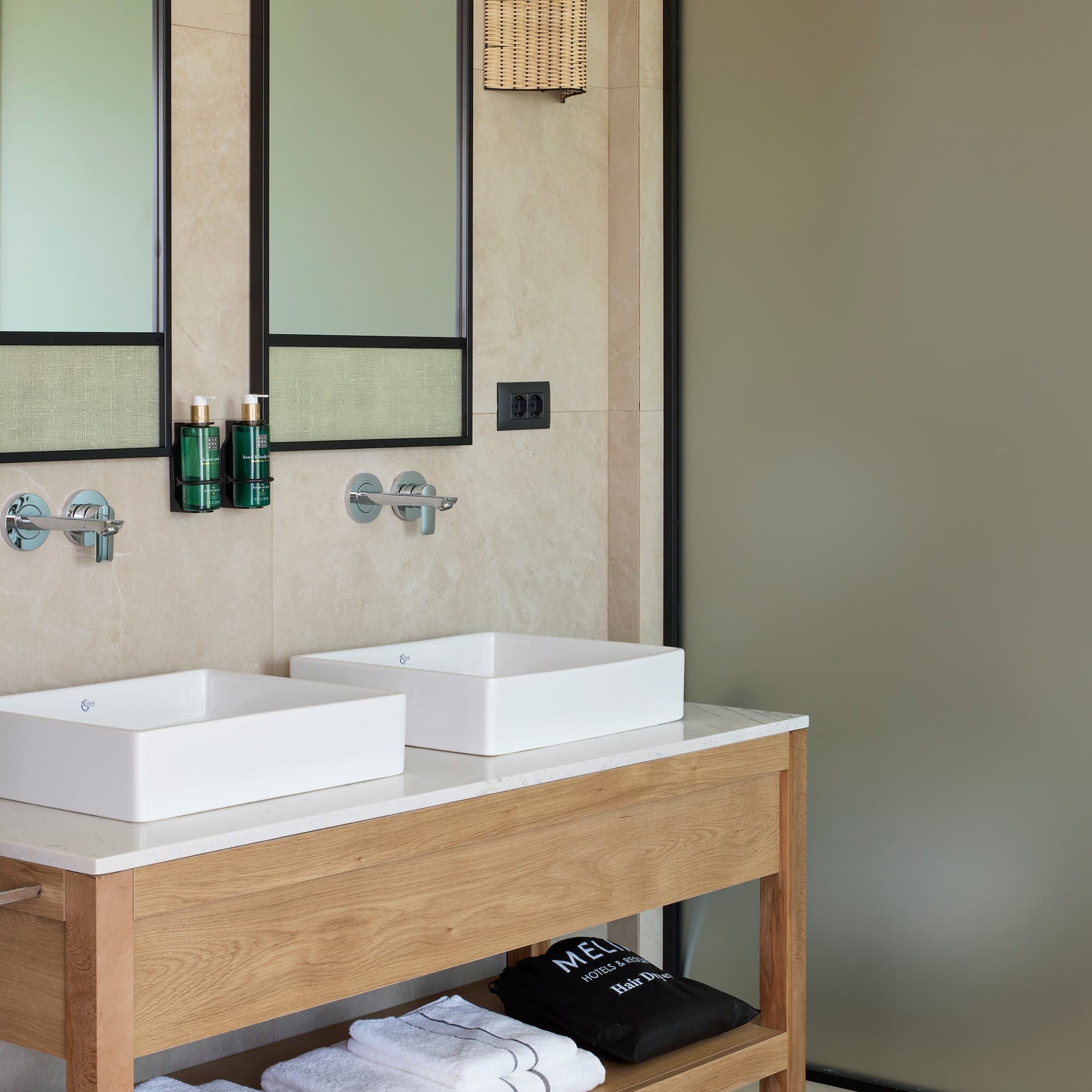 a bathroom with sinks and mirrors
