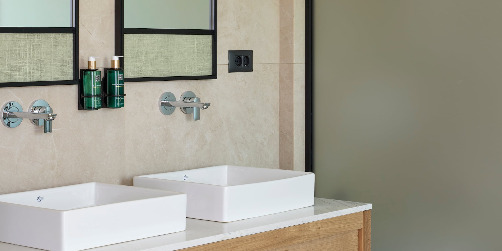 a bathroom with sinks and mirrors