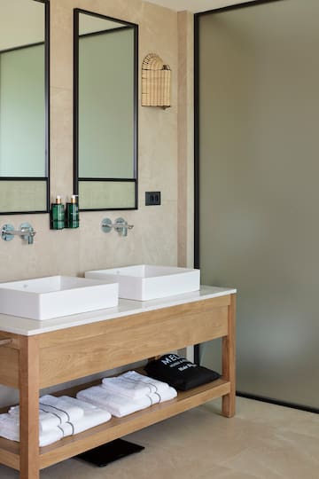 a bathroom with sinks and mirrors
