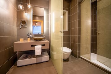 a bathroom with a shower and sink