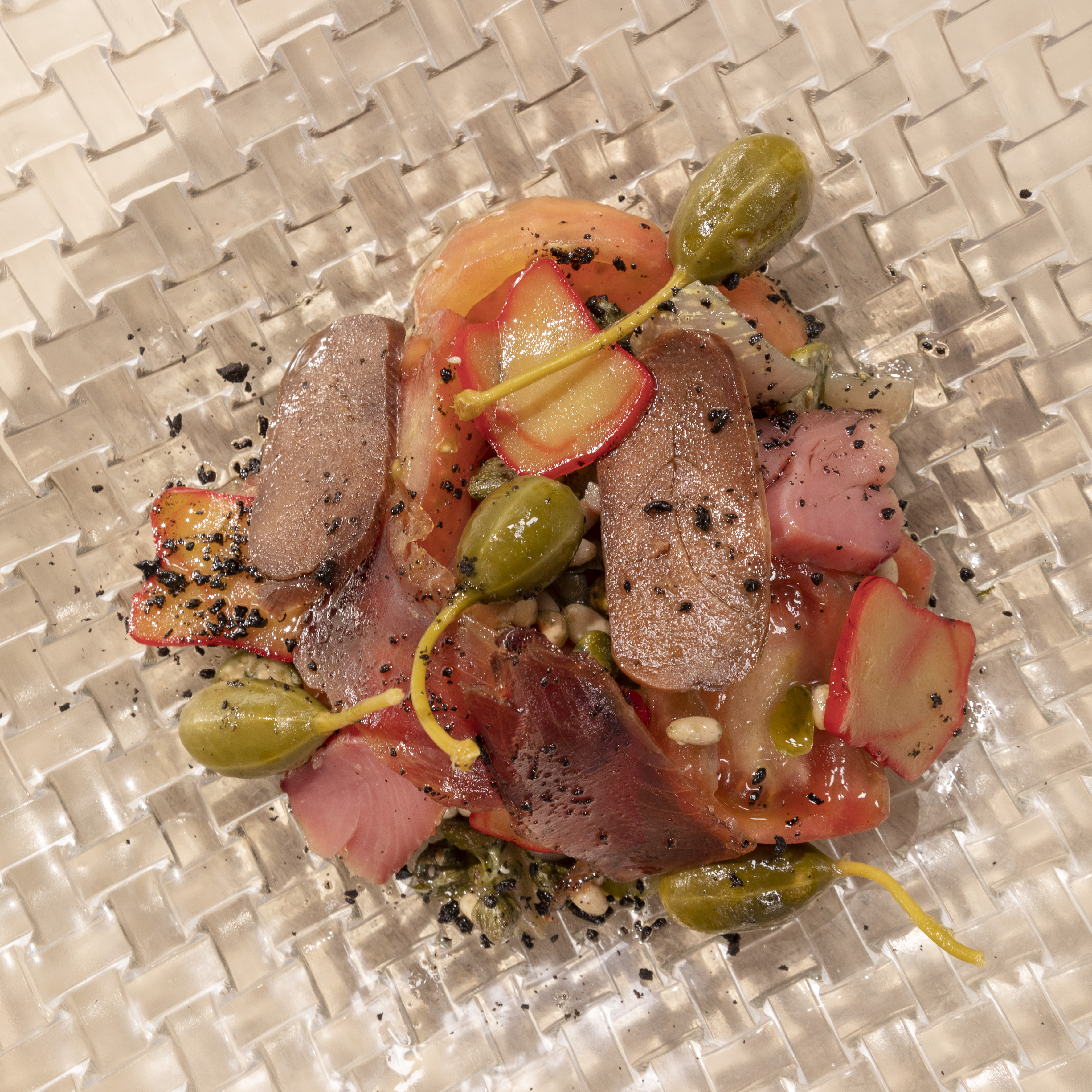 Cured tuna, fresh tuna, tomato salad with caper berries, pine nuts.
