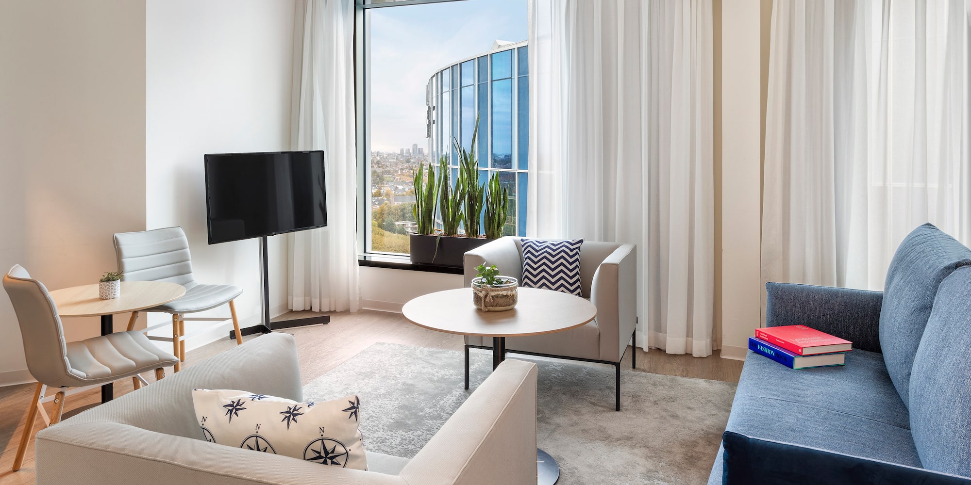 a living room with a television and a table