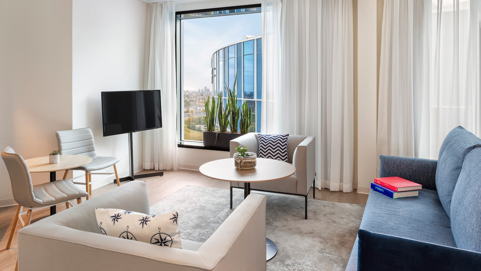 a living room with a television and a table