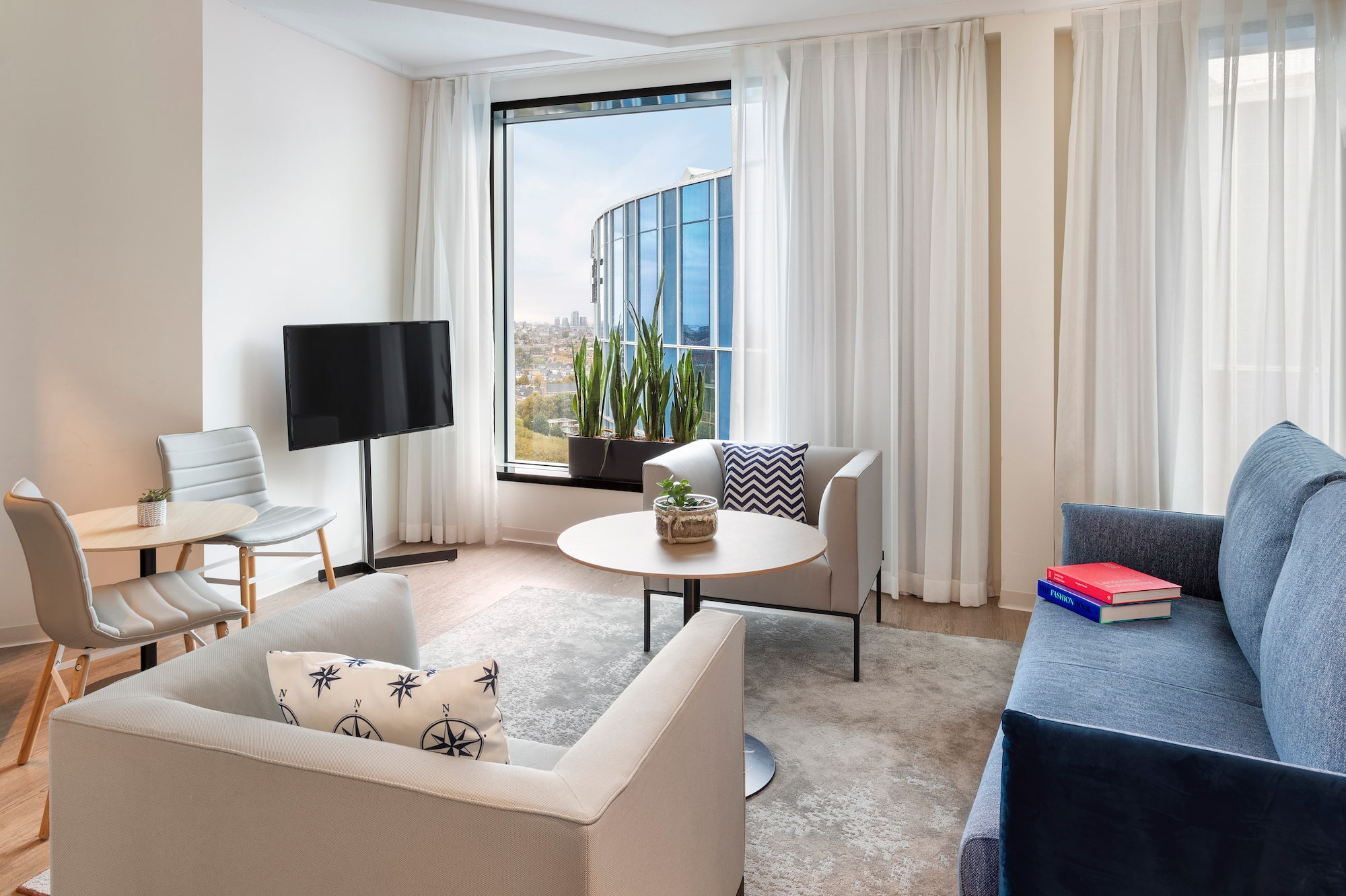 a living room with a television and a table