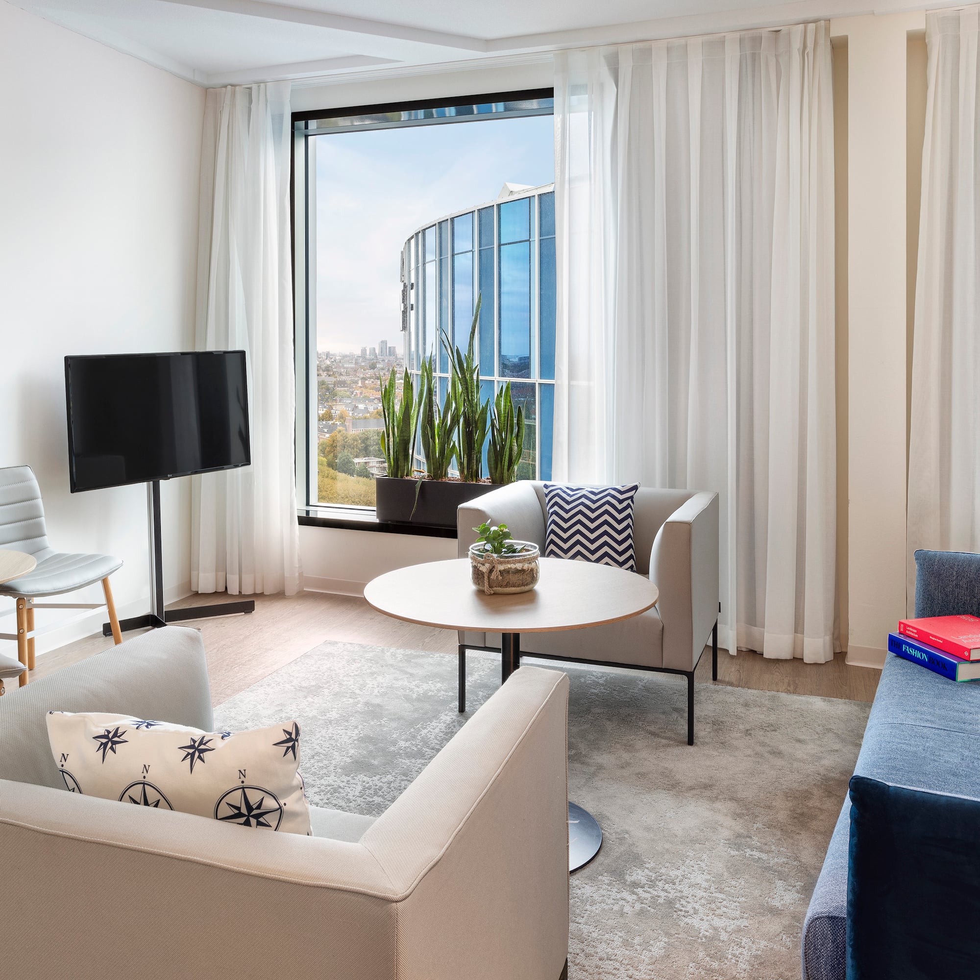 a living room with a television and a table