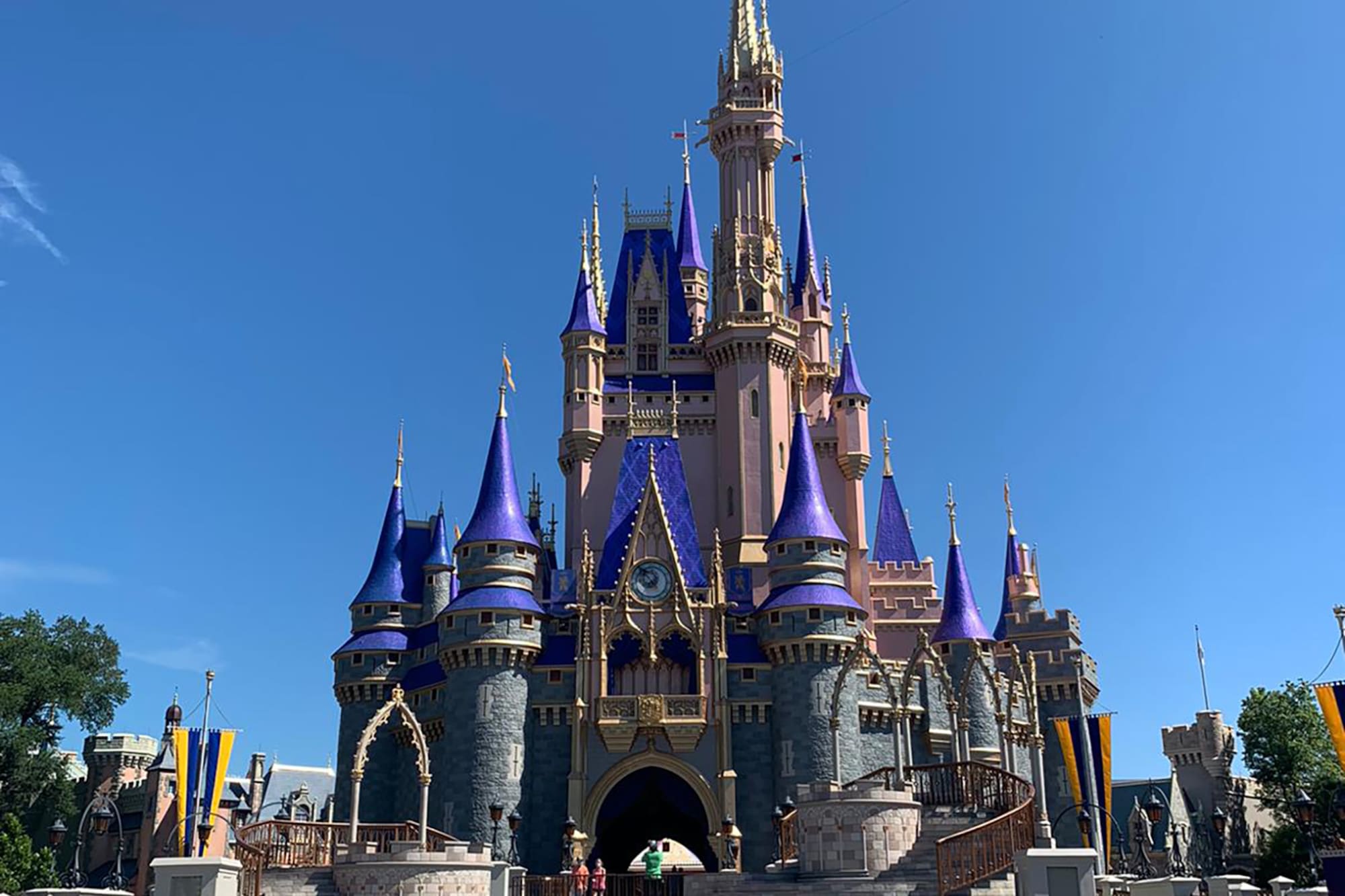 Iconic Cinderella Castle with blue and pink spires at Magic Kingdom.